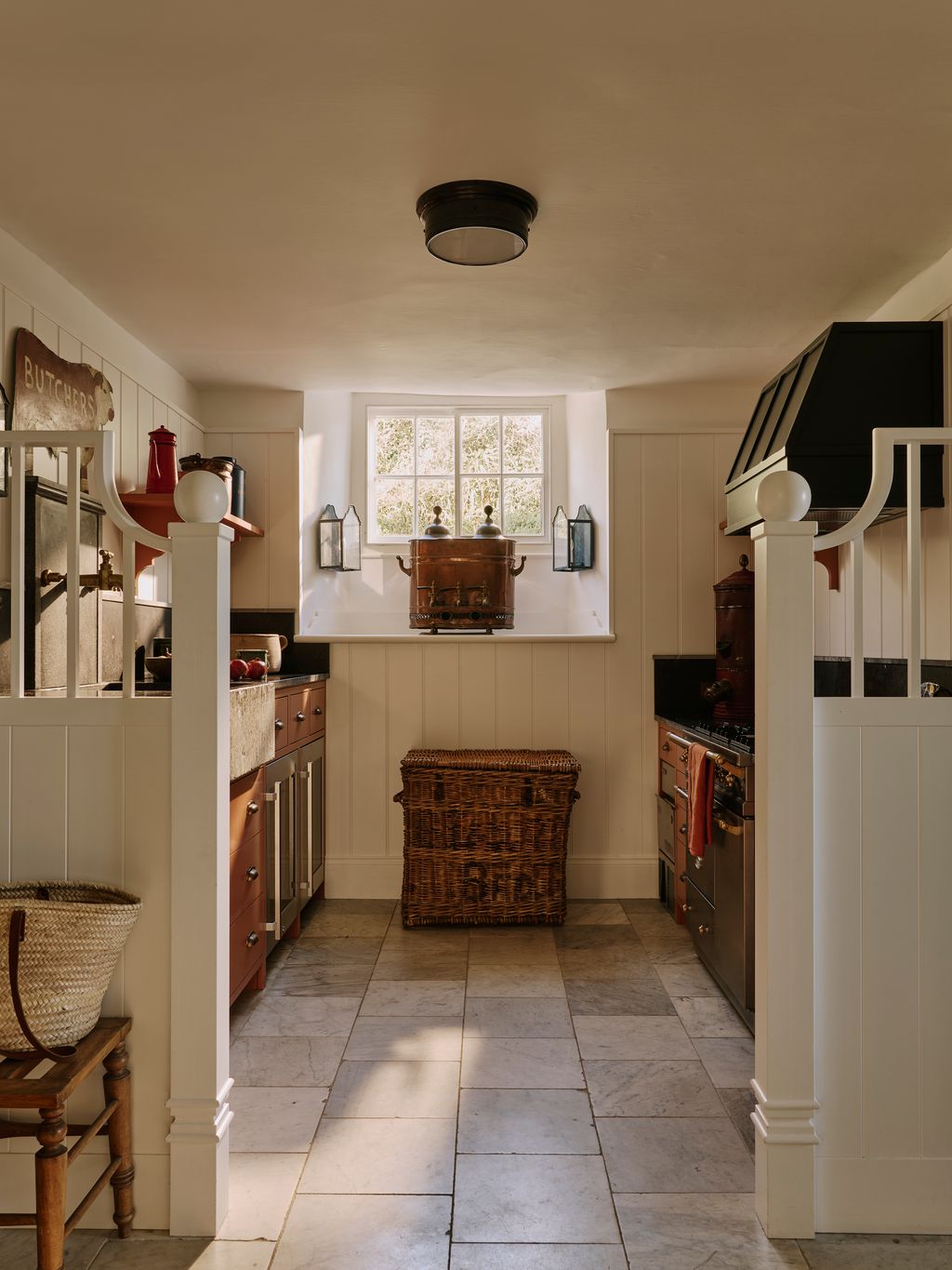 Image may contain Floor Flooring Indoors Interior Design Lamp Kitchen Desk Furniture Table and Cooktop