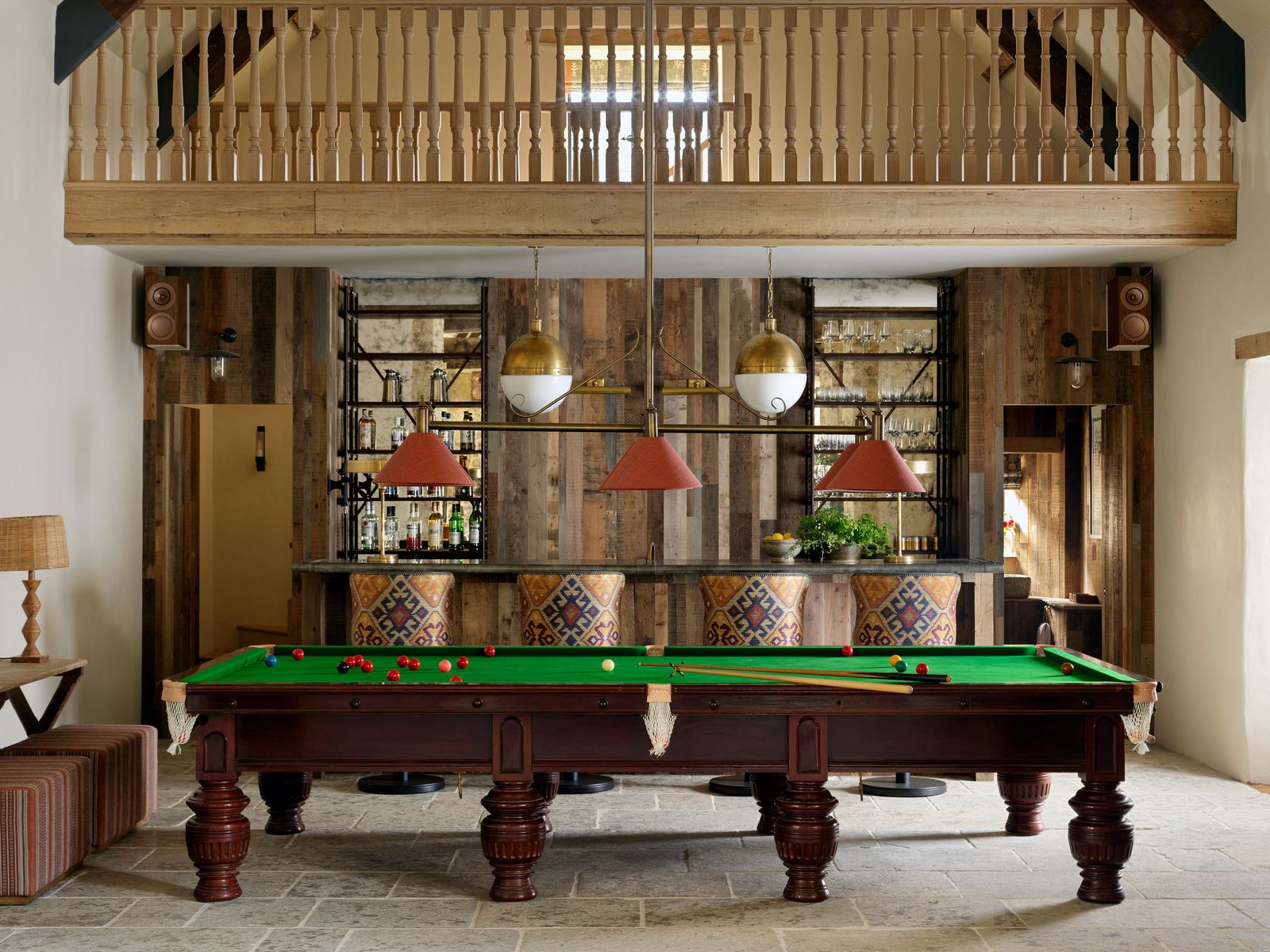 Image may contain Furniture Table Indoors Lamp Desk Plant Electronics Speaker Billiard Room Pool Table and Room