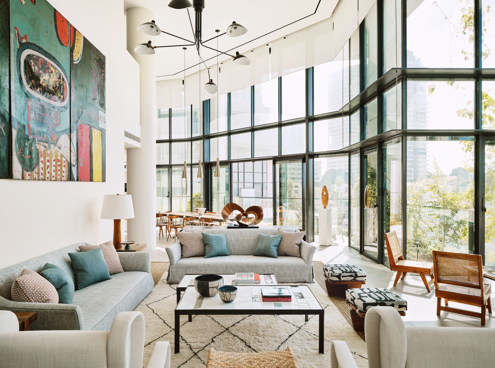 Image may contain Home Decor Chair Furniture Lamp Table Couch Architecture Building Indoors Living Room and Room