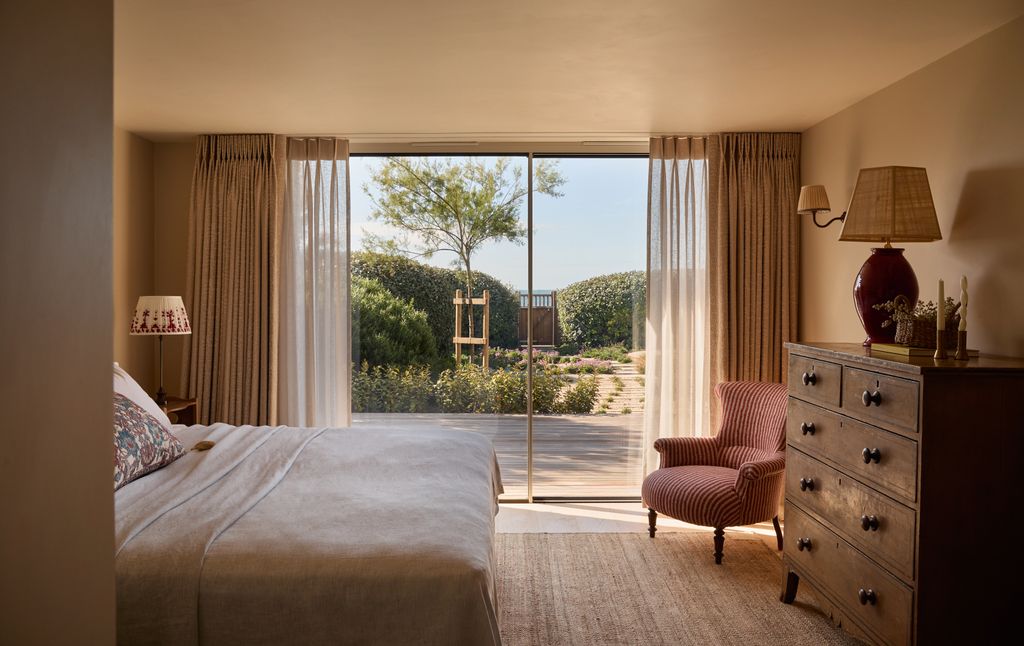 Image may contain Lamp Chair Furniture Indoors Interior Design Bed Home Decor Candle Bedroom and Room