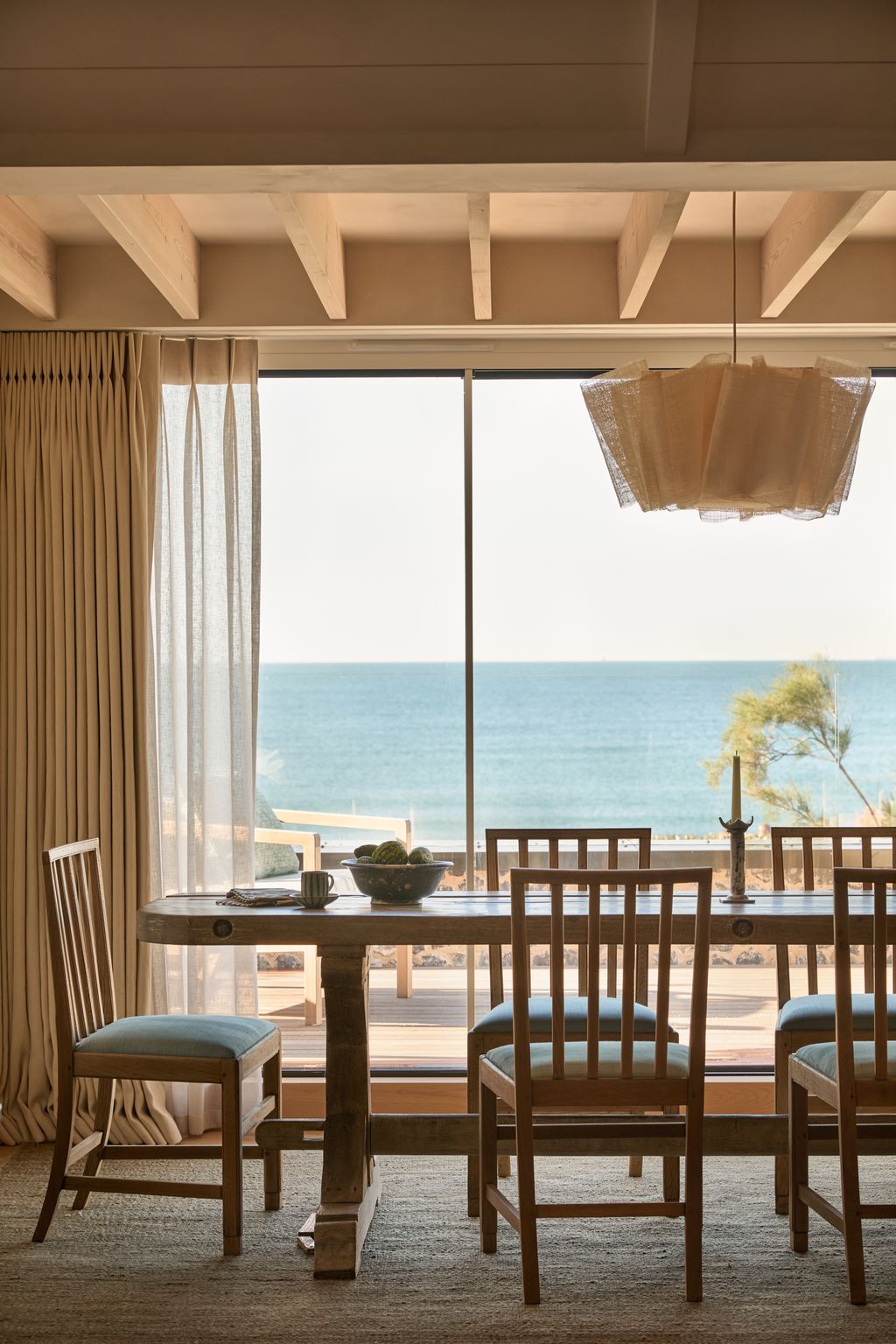 Image may contain Architecture Building Dining Room Dining Table Furniture Indoors Room Table and Chair