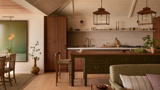 Image may contain Indoors Interior Design Home Decor Plant Lamp Chair Furniture Architecture and Building