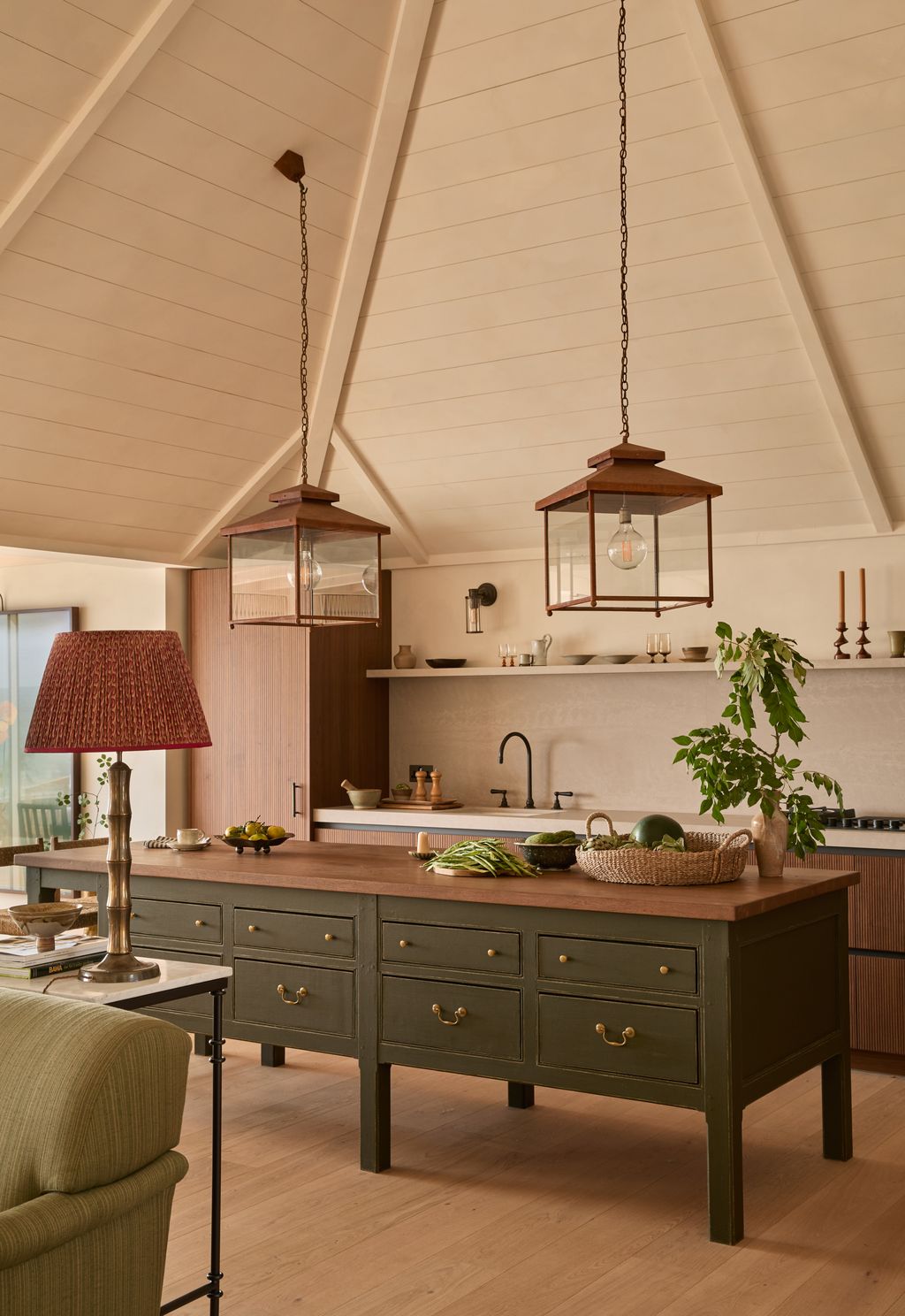 Image may contain Indoors Interior Design Lamp Kitchen Plant Chair Furniture Cup Sink and Sink Faucet