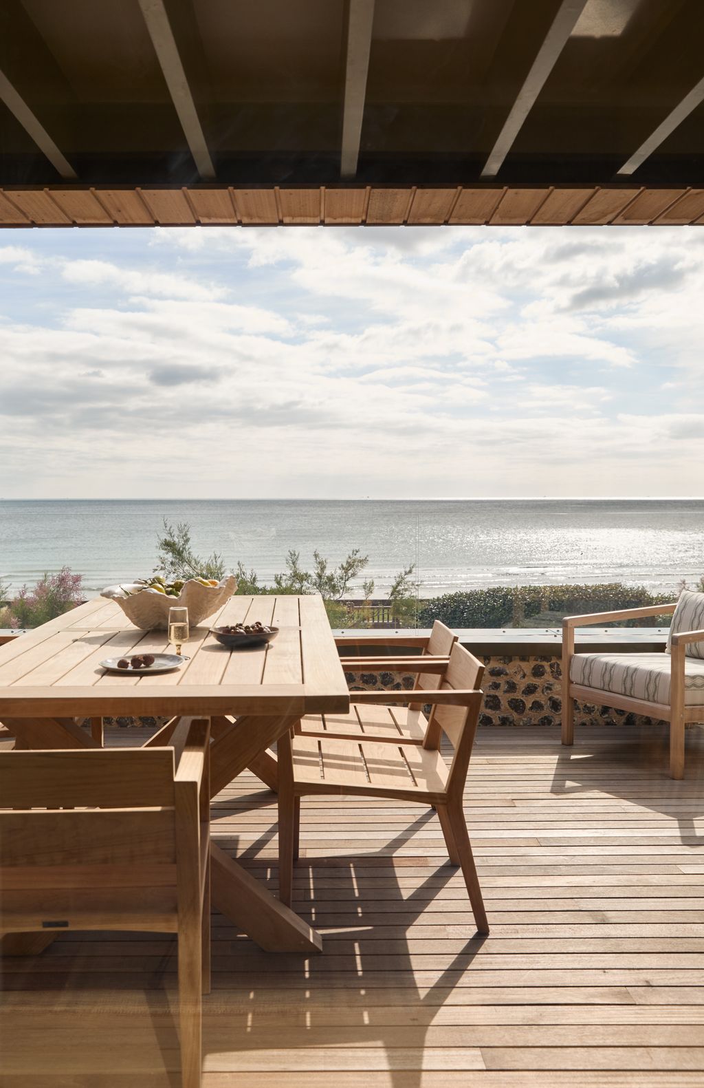 Image may contain Nature Outdoors Scenery Chair Furniture Wood Plate Table Indoors Interior Design and Cup