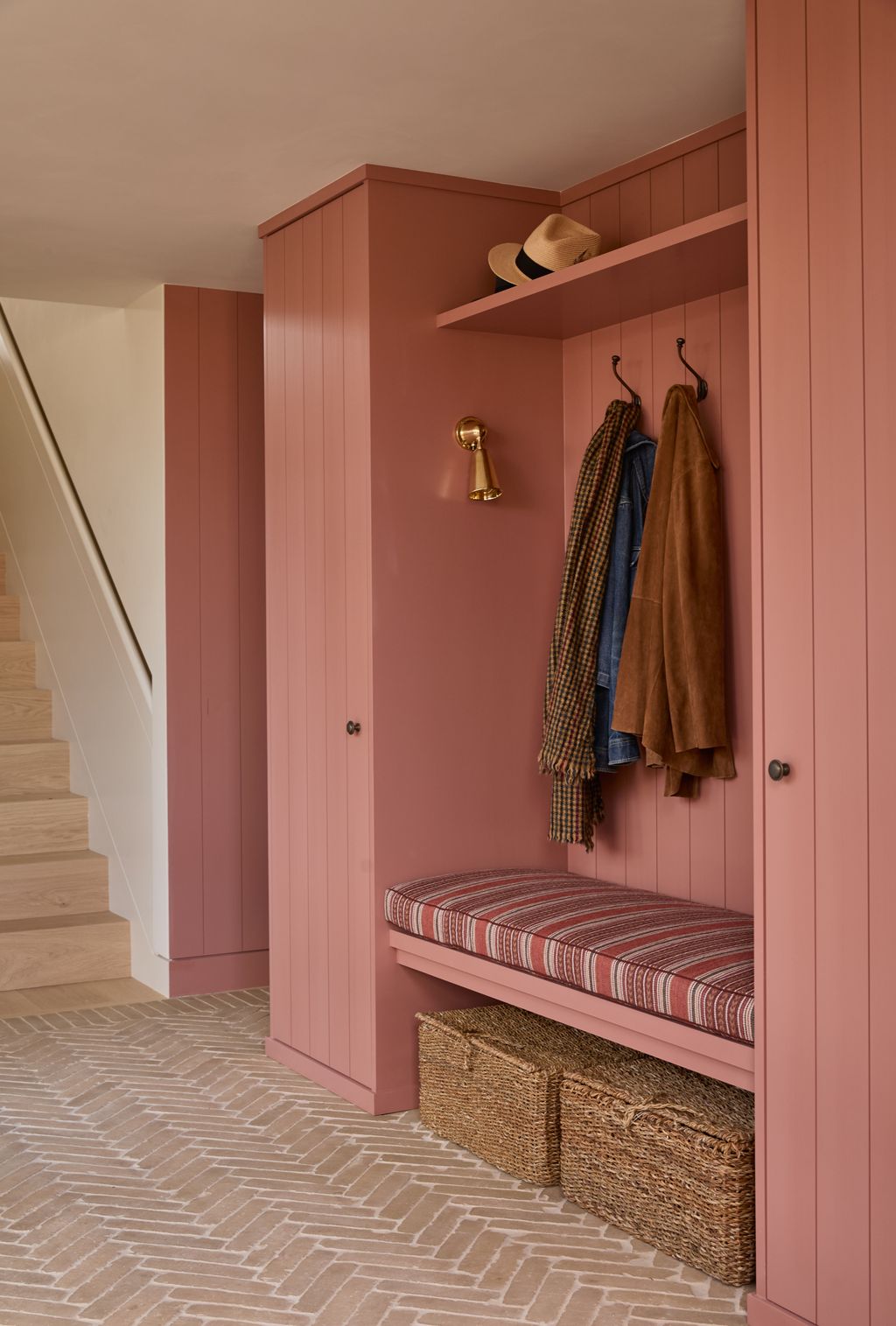 Image may contain Indoors Interior Design Lamp Furniture Clothing Hat Floor and Bench