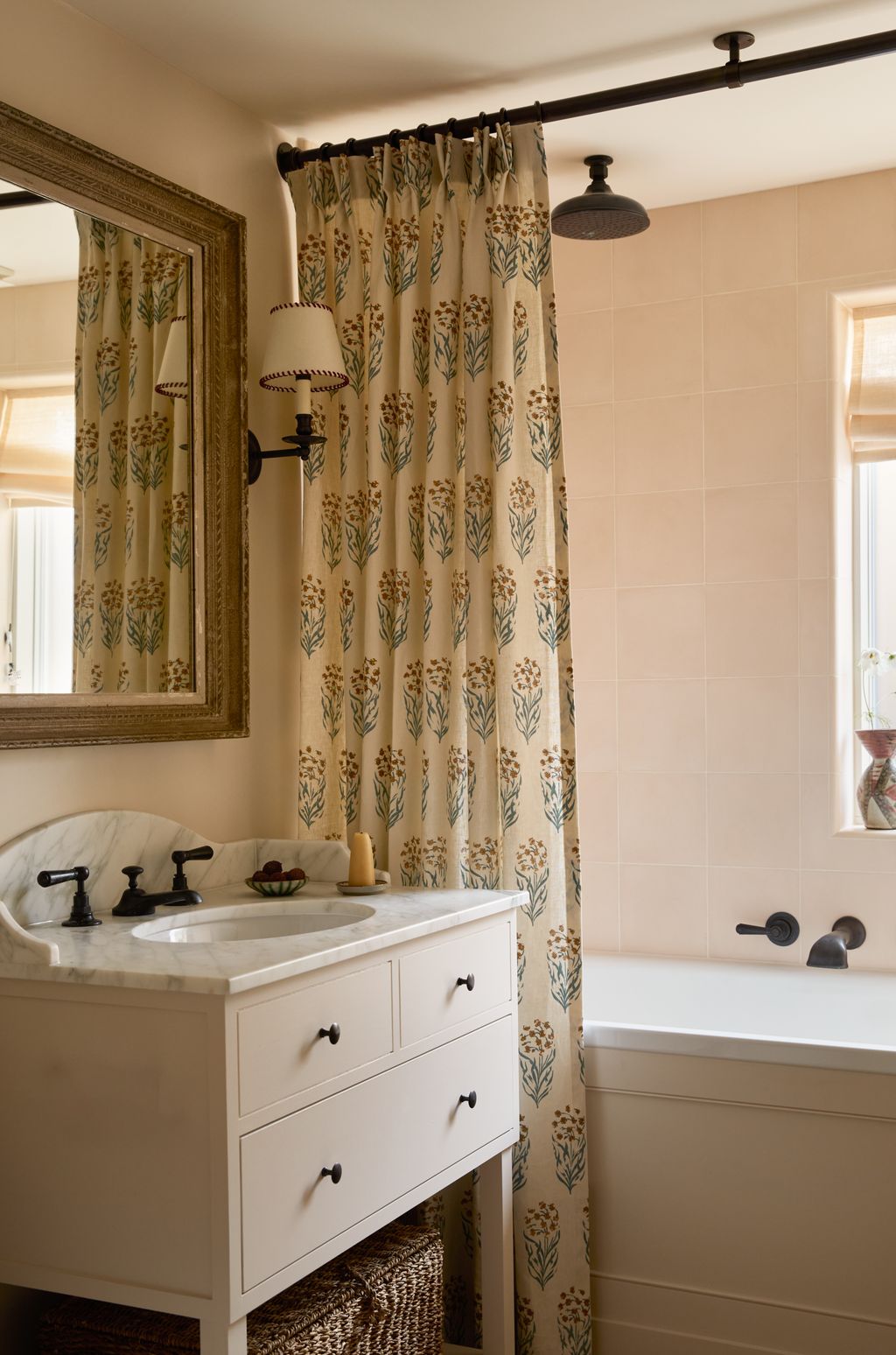 Image may contain Sink Bathroom Indoors Room Shower Faucet Interior Design Lamp Sink Faucet Candle and Curtain