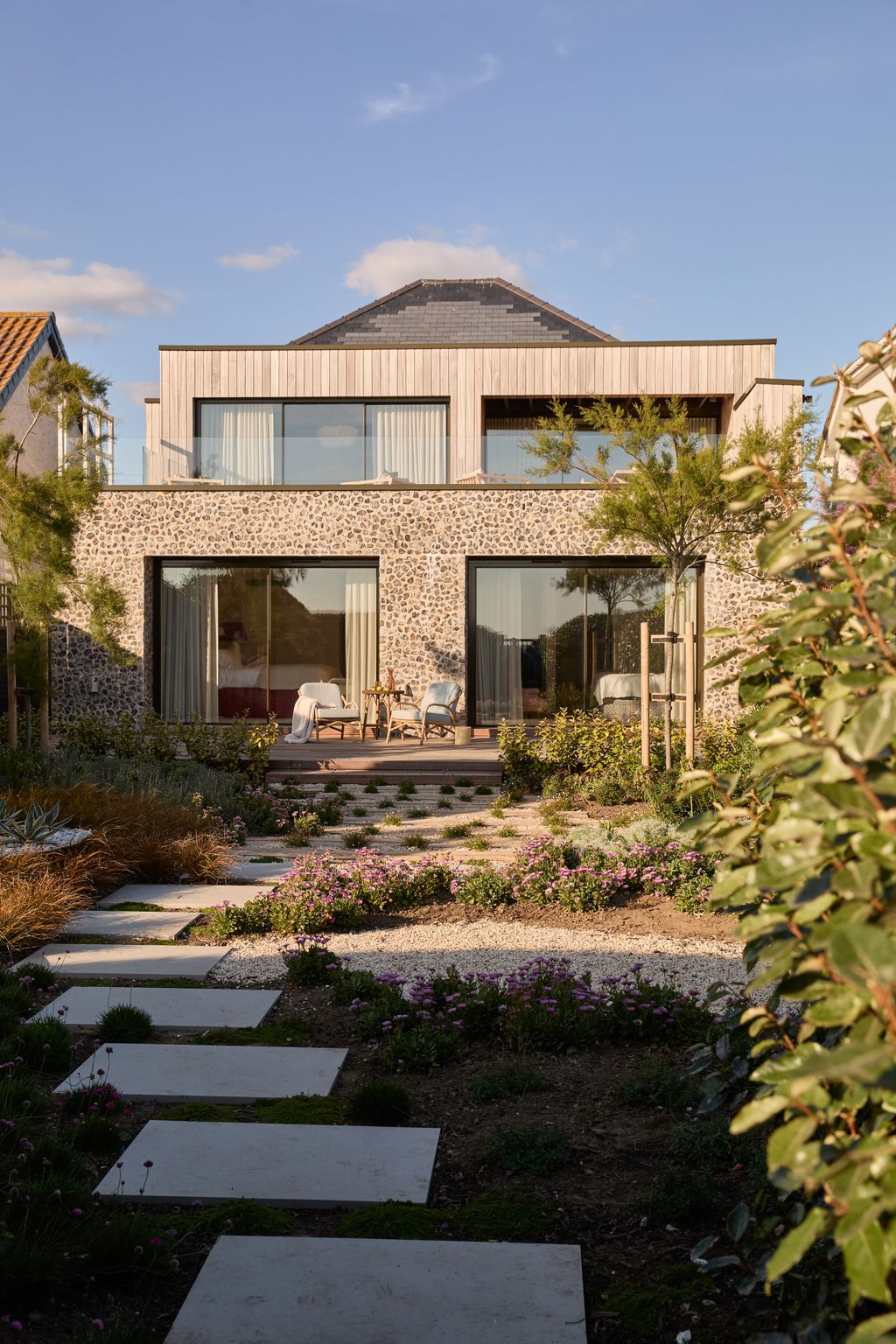 Image may contain Path Walkway Flagstone Architecture Building House Housing Villa Chair Furniture Floor and Desk