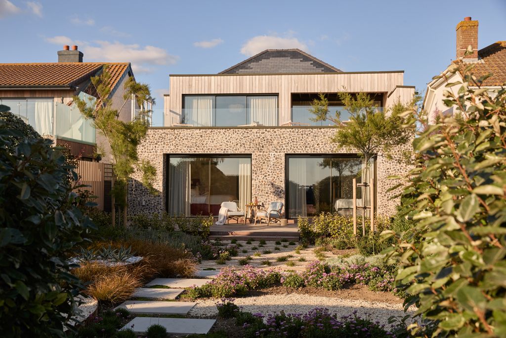 Image may contain Architecture Building House Housing Villa Cottage Chair Furniture and Outdoors