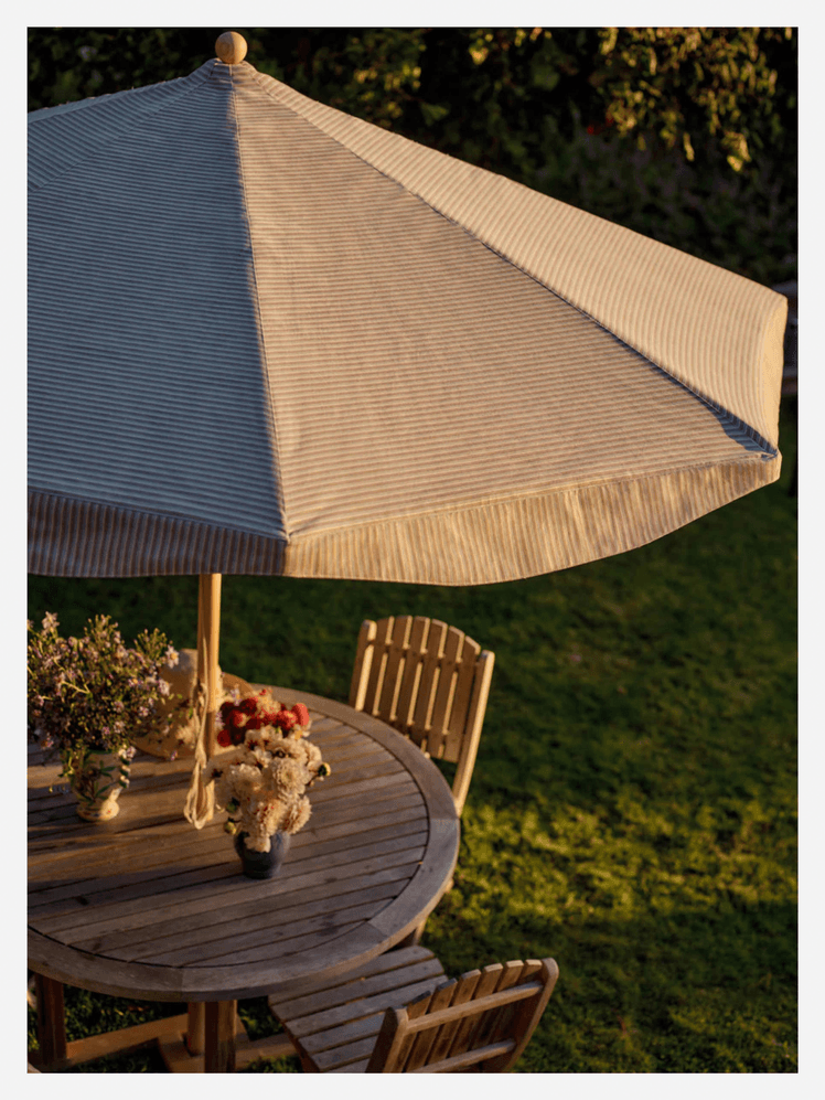 Image may contain: Architecture, Building, House, Housing, Patio, Flower, Flower Arrangement, Plant, Wood, and Flower Bouquet