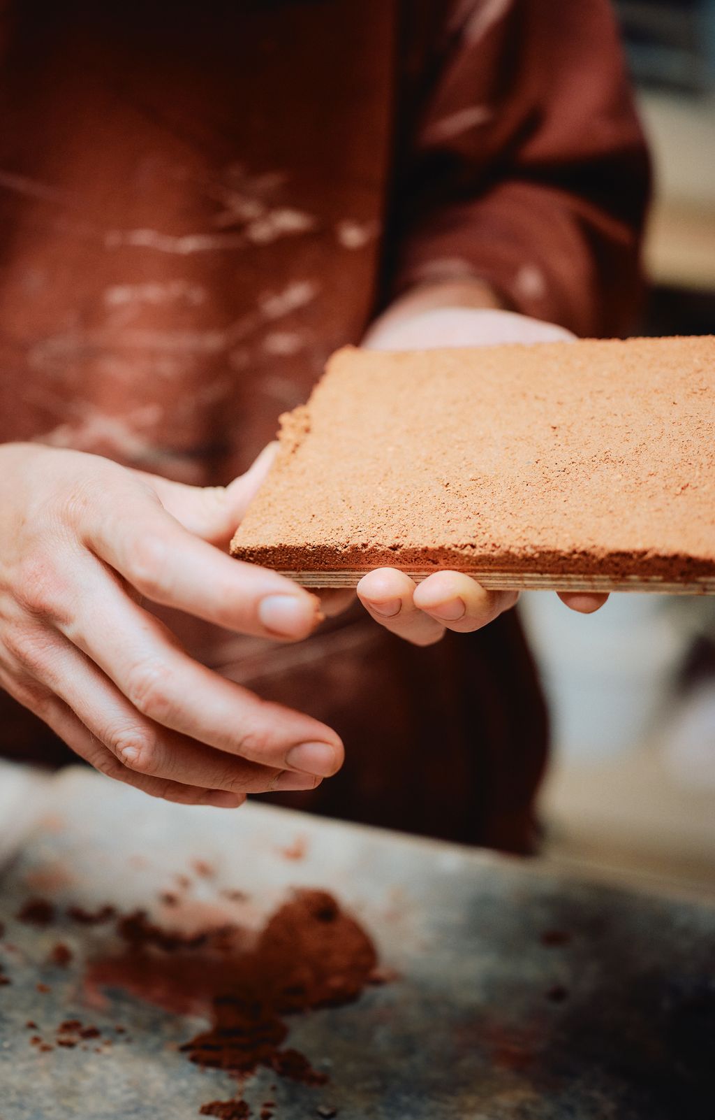 Image may contain Body Part Finger Hand Person Bread Food Adult and Brick