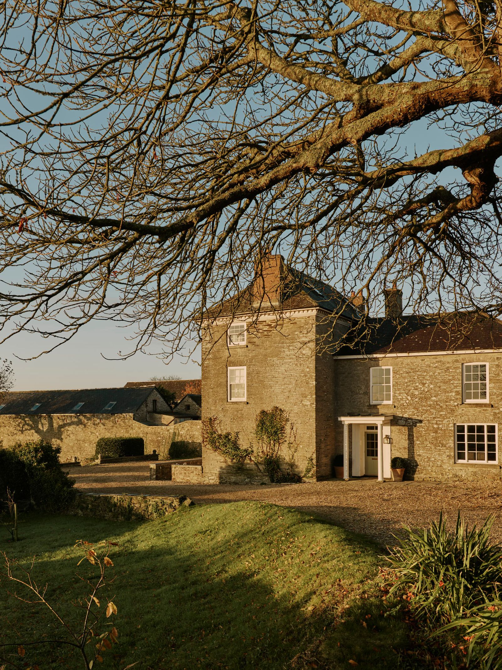 Image may contain Grass Plant Tree Architecture Building Outdoors Shelter Cottage House Housing Villa and Lawn