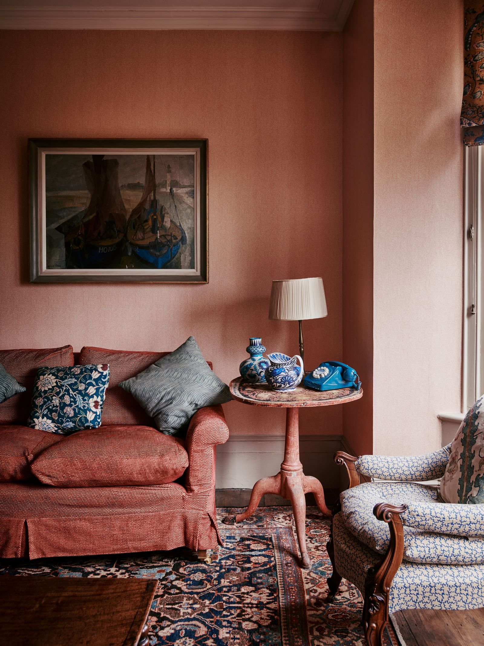 Image may contain Architecture Building Furniture Indoors Living Room Room Couch Home Decor Cushion Lamp and Art