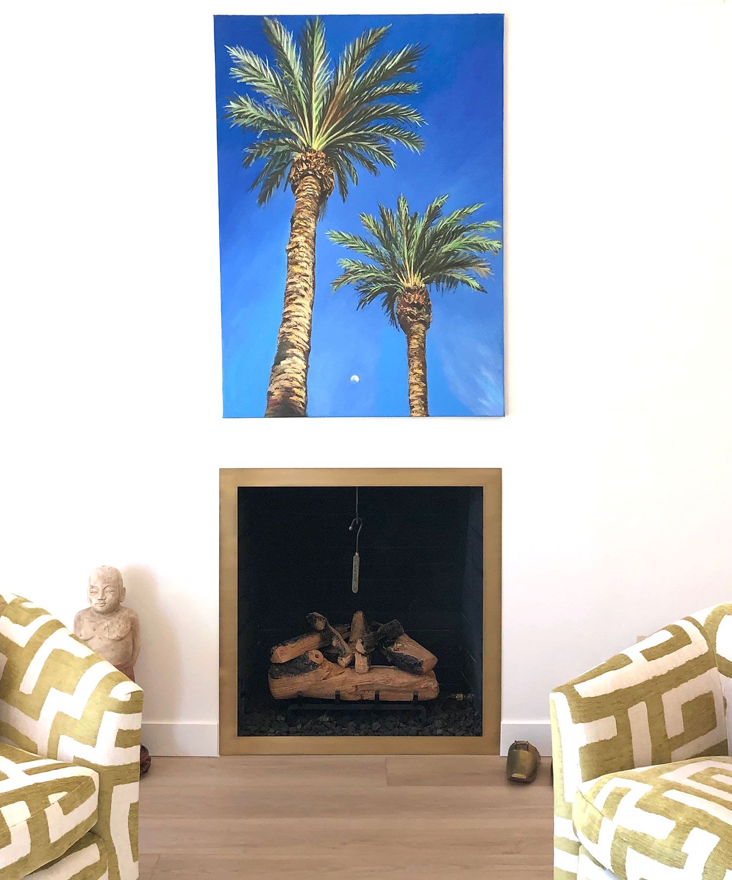 Image may contain: Sun Tzu, Plant, Tree, Fireplace, Indoors, Adult, Person, Interior Design, Palm Tree, Couch, and Furniture