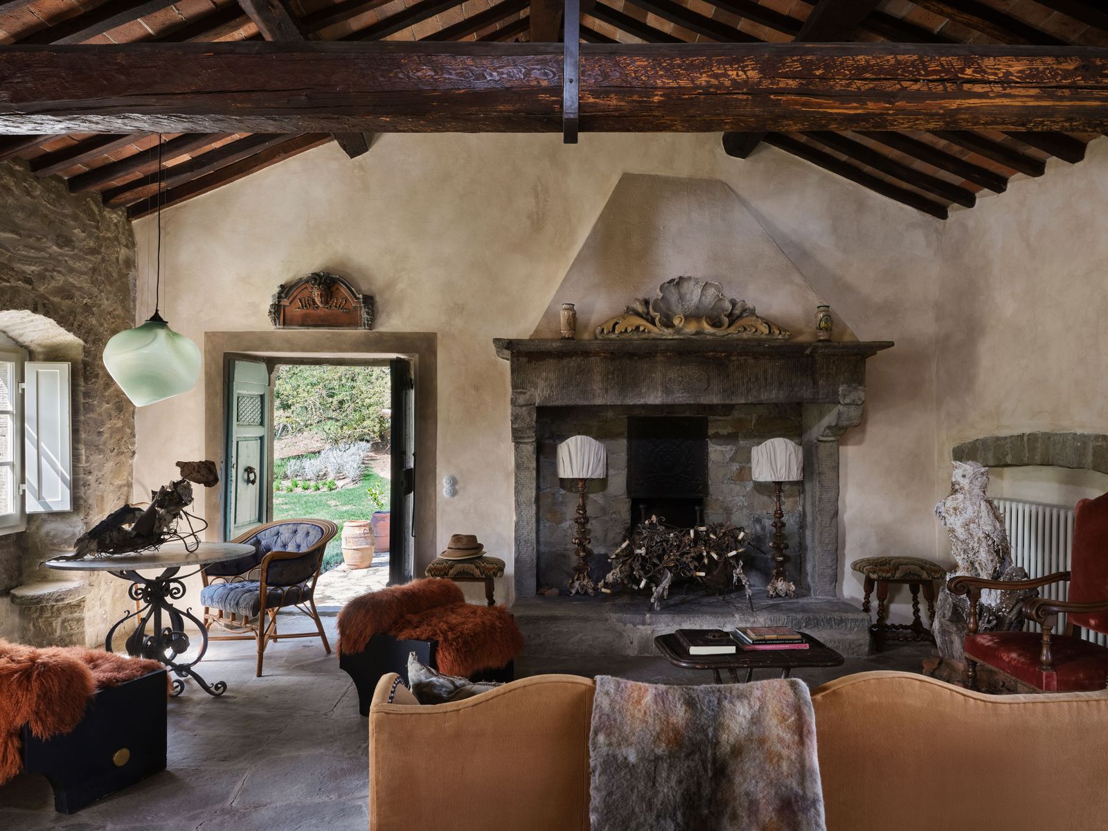 Image may contain Fireplace Indoors Book Publication Chair Furniture Lamp Desk Table Architecture and Building