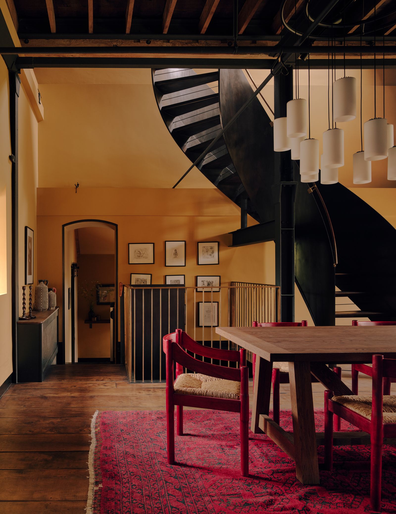 Image may contain Indoors Interior Design Home Decor Architecture Building House Housing Staircase and Dining Room