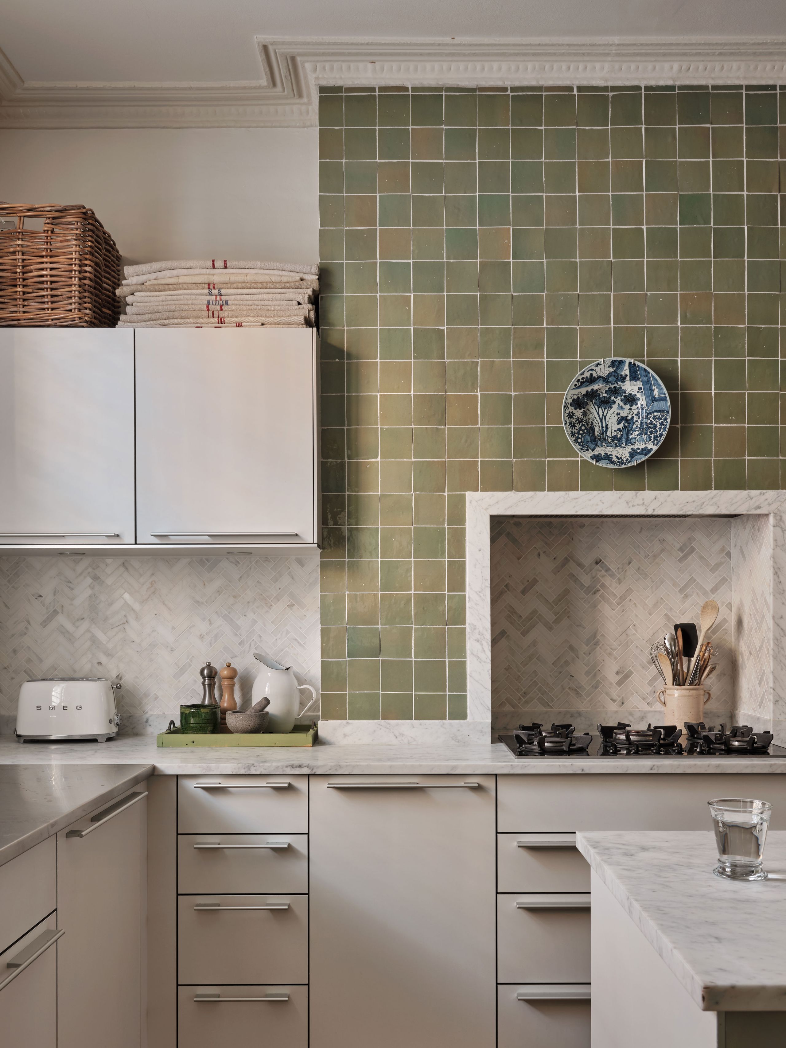 Image may contain: Indoors, Interior Design, Kitchen, Cup, Cooktop, and Plate