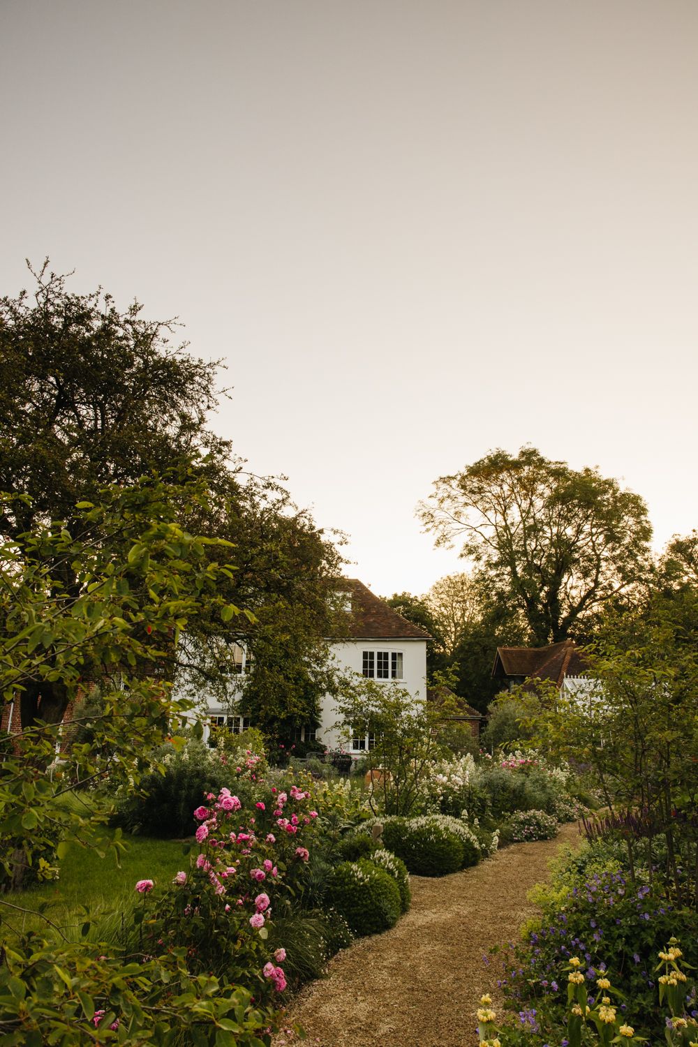 Image may contain Garden Nature Outdoors Grass Plant Vegetation Tree Park Architecture Building Cottage and House