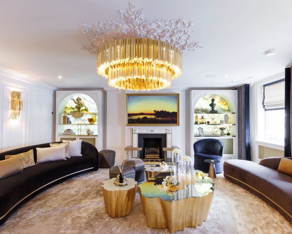 Image may contain: Home Decor, Chandelier, Lamp, Architecture, Building, Furniture, Indoors, Living Room, Room, and Table