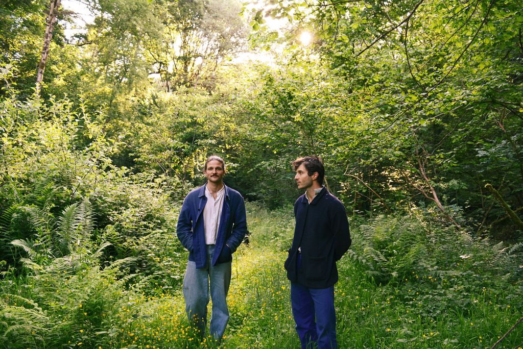 Image may contain Grove Land Nature Outdoors Plant Tree Vegetation Woodland Person Walking Jungle and Clothing
