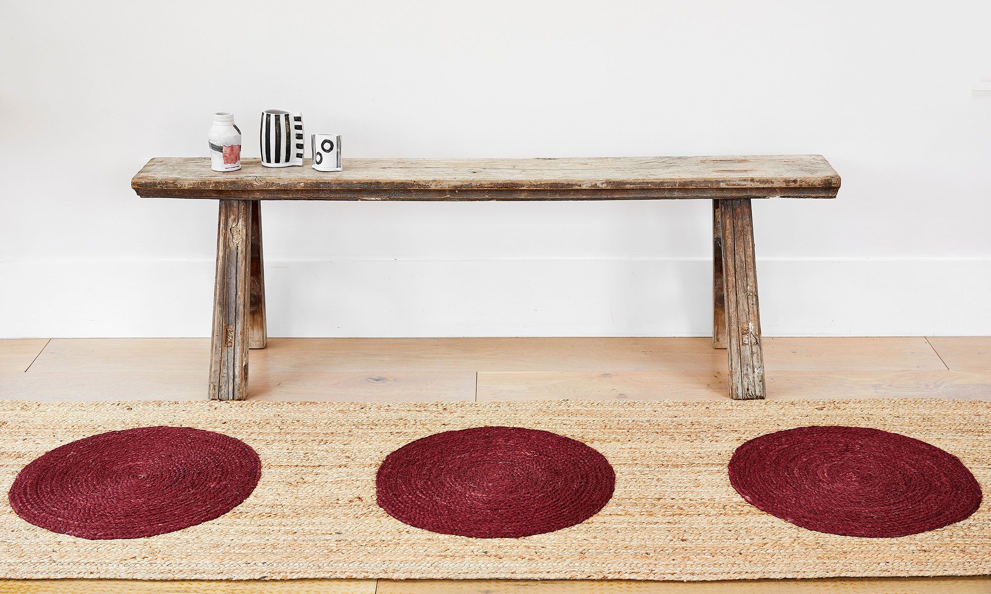 Image may contain: Home Decor, Rug, Coffee Table, Furniture, Table, and Bench