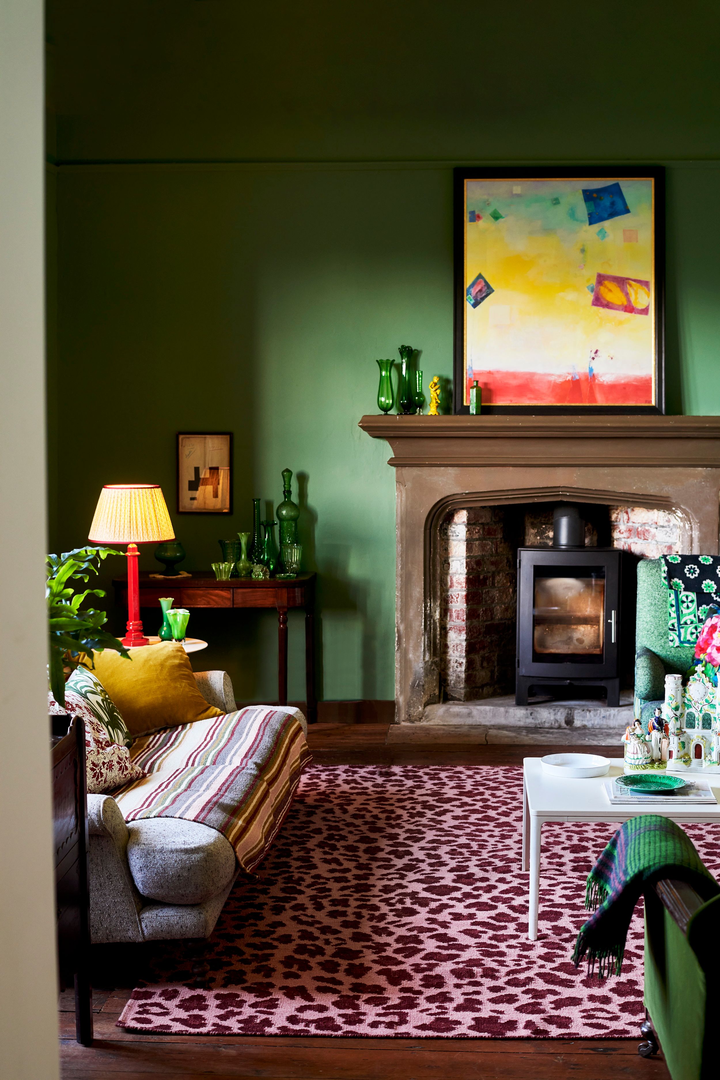 Image may contain: Home Decor, Lamp, Fireplace, Indoors, Art, Painting, Rug, Couch, Furniture, Architecture, and Building