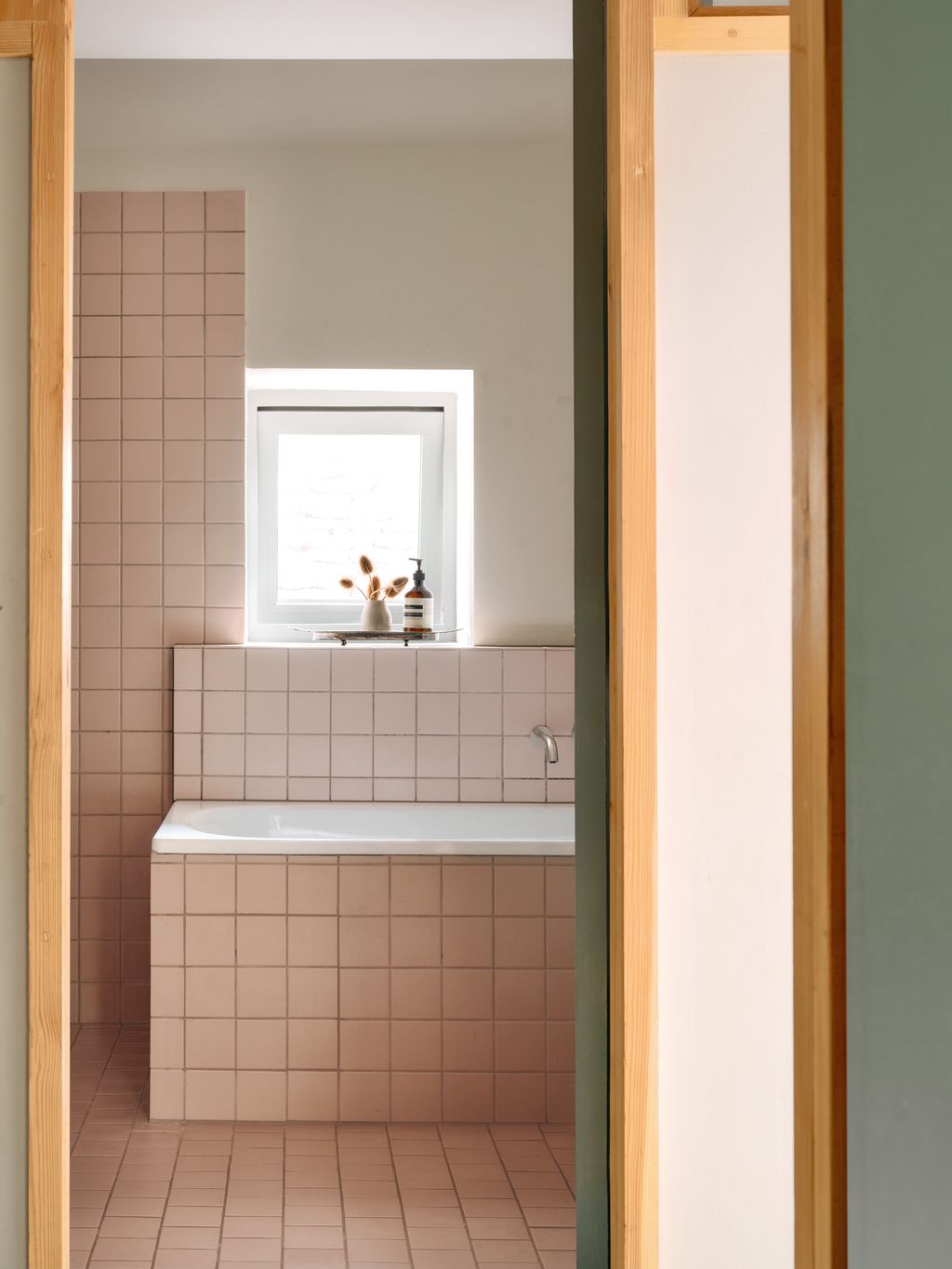 Image may contain Indoors Interior Design Bathing Bathtub Person Tub Sink and Sink Faucet