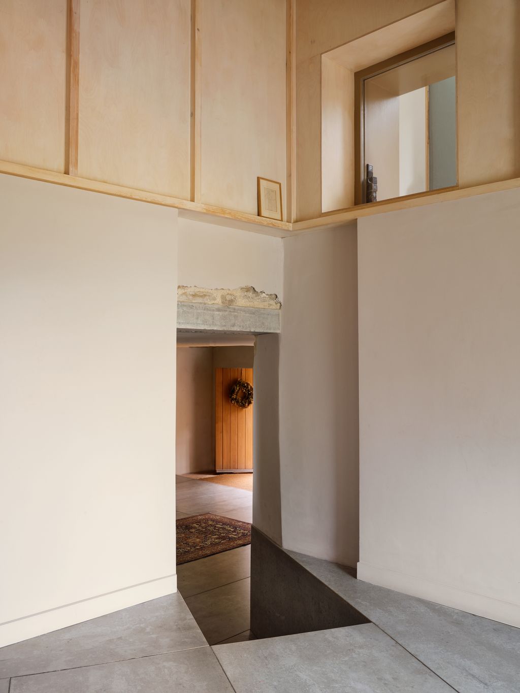 Image may contain Corner Floor Flooring Indoors Interior Design Home Decor and Rug