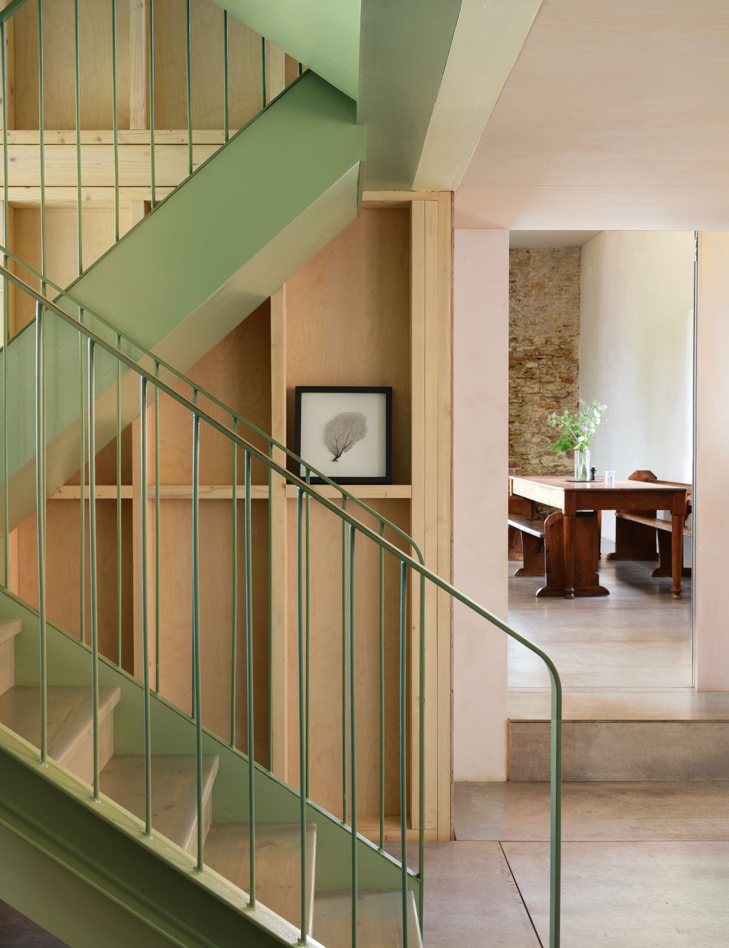 Image may contain Architecture Building House Housing Staircase Handrail Desk Furniture Table and Indoors