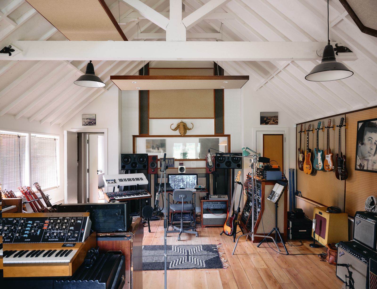 Image may contain Ry Cooder Lamp Home Decor Rug Chair Furniture Person Keyboard Musical Instrument and Piano