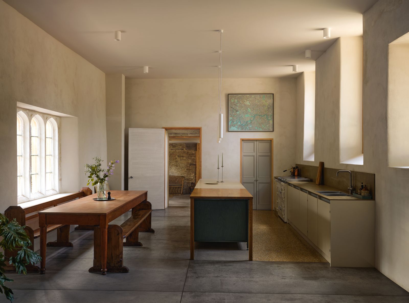 Image may contain Corner Sink Sink Faucet Indoors Interior Design Dining Table Furniture Table and Floor