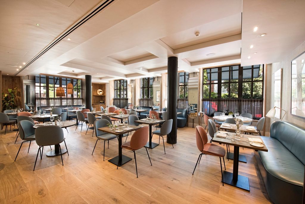 Image may contain Indoors Restaurant Architecture Building Dining Room Dining Table Furniture Room and Table