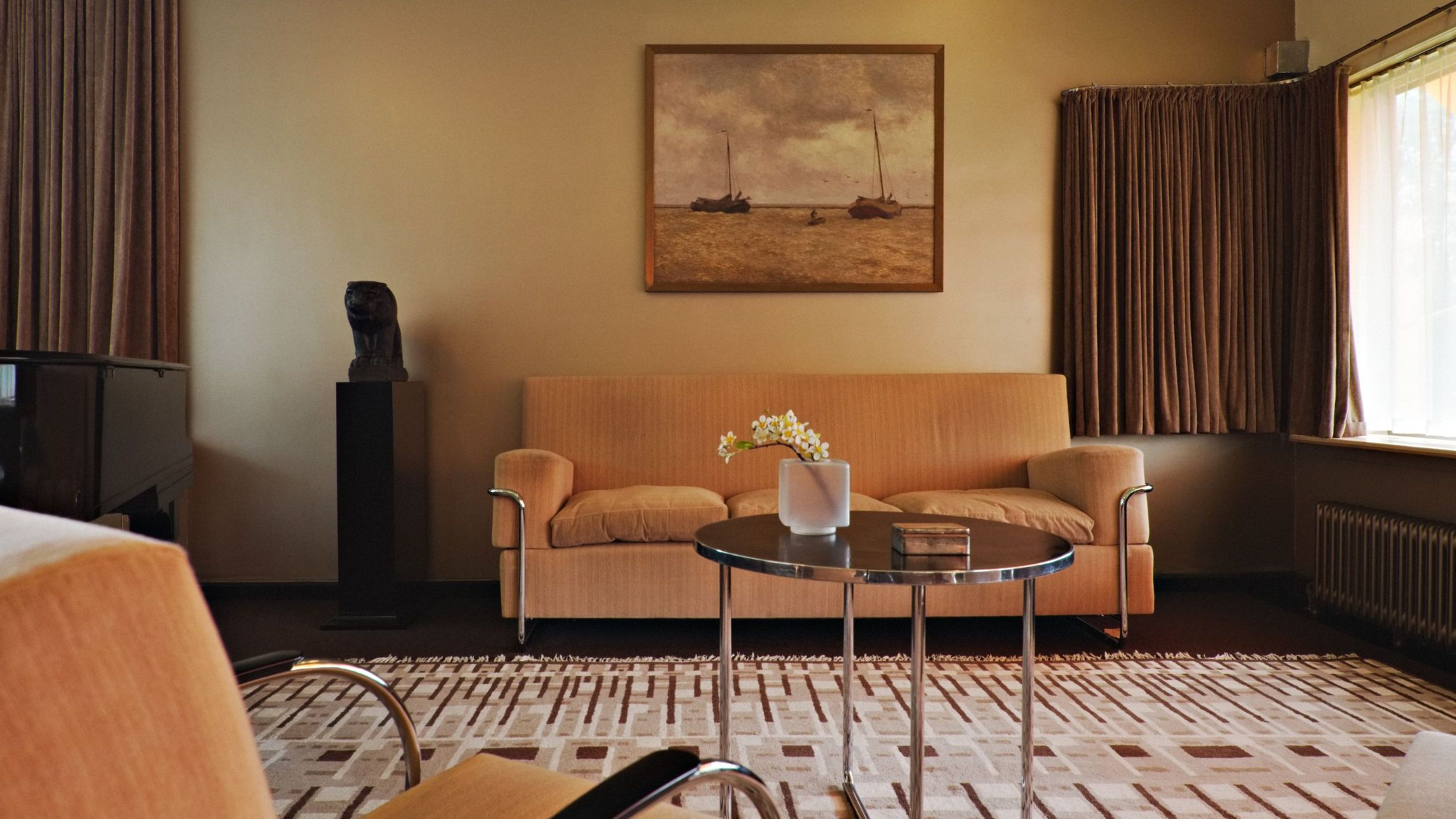 Image may contain Home Decor Architecture Building Furniture Indoors Living Room Room Coffee Table Table and Rug