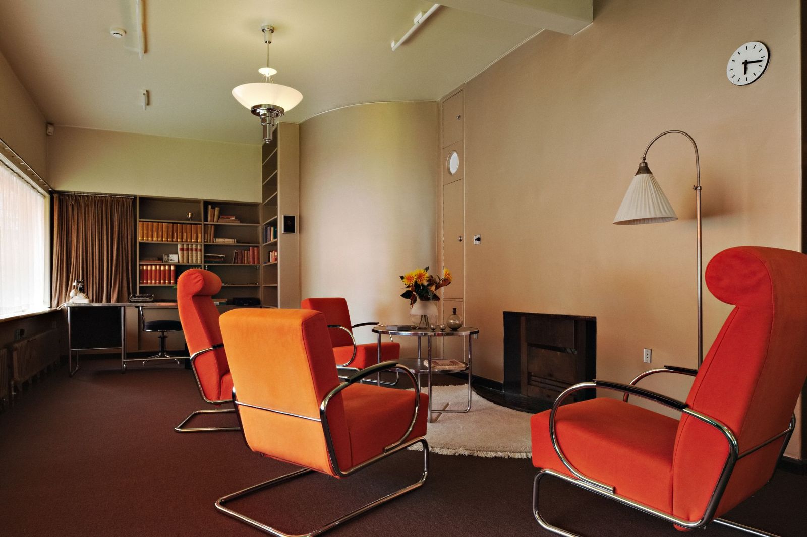 Image may contain Lamp Chair Furniture Desk Table Architecture Building Indoors Living Room Room and Armchair