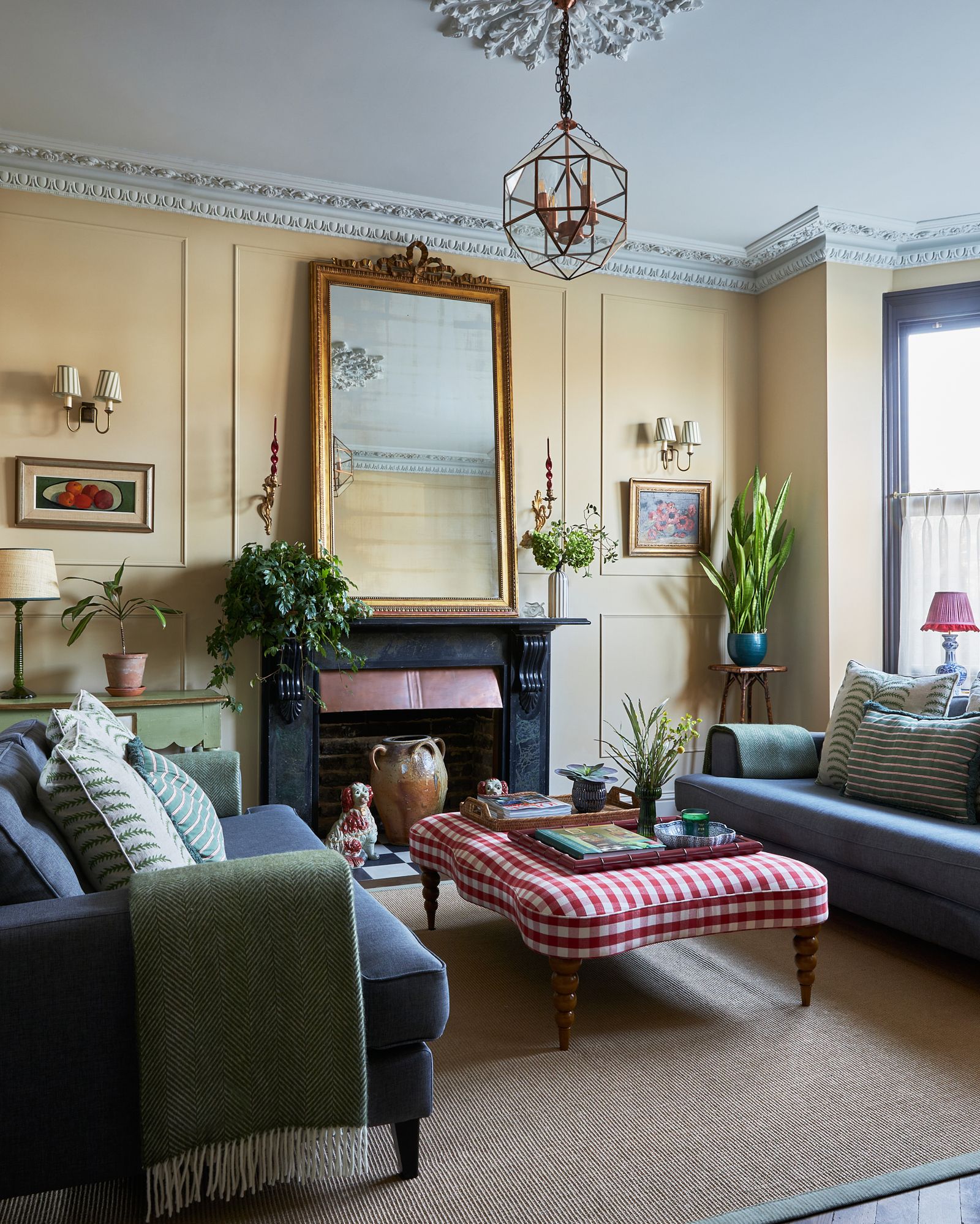 Image may contain Lamp Plant Home Decor Couch Furniture Art Painting Book Publication Desk Table and Accessories