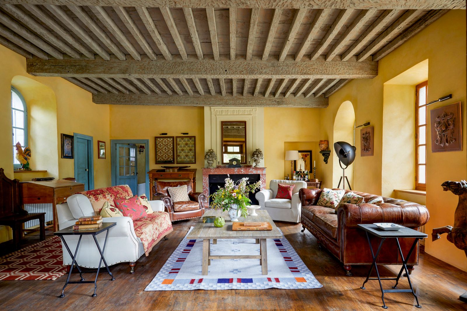 Image may contain Home Decor Architecture Building Furniture Indoors Living Room Room Couch Interior Design and Rug