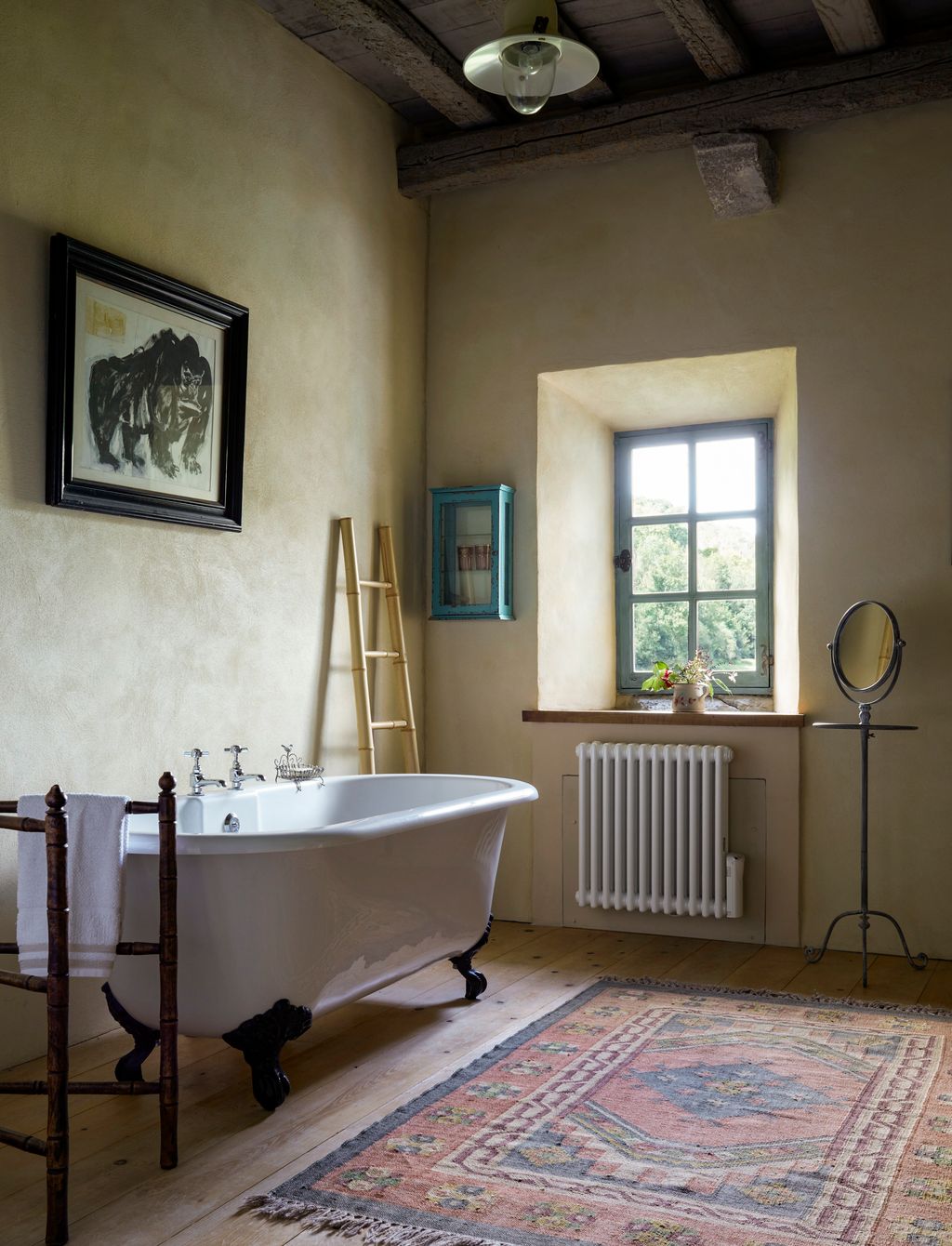 Image may contain Home Decor Rug Lamp Bathing Art Painting Indoors Interior Design Bathtub Person Tub and Sink