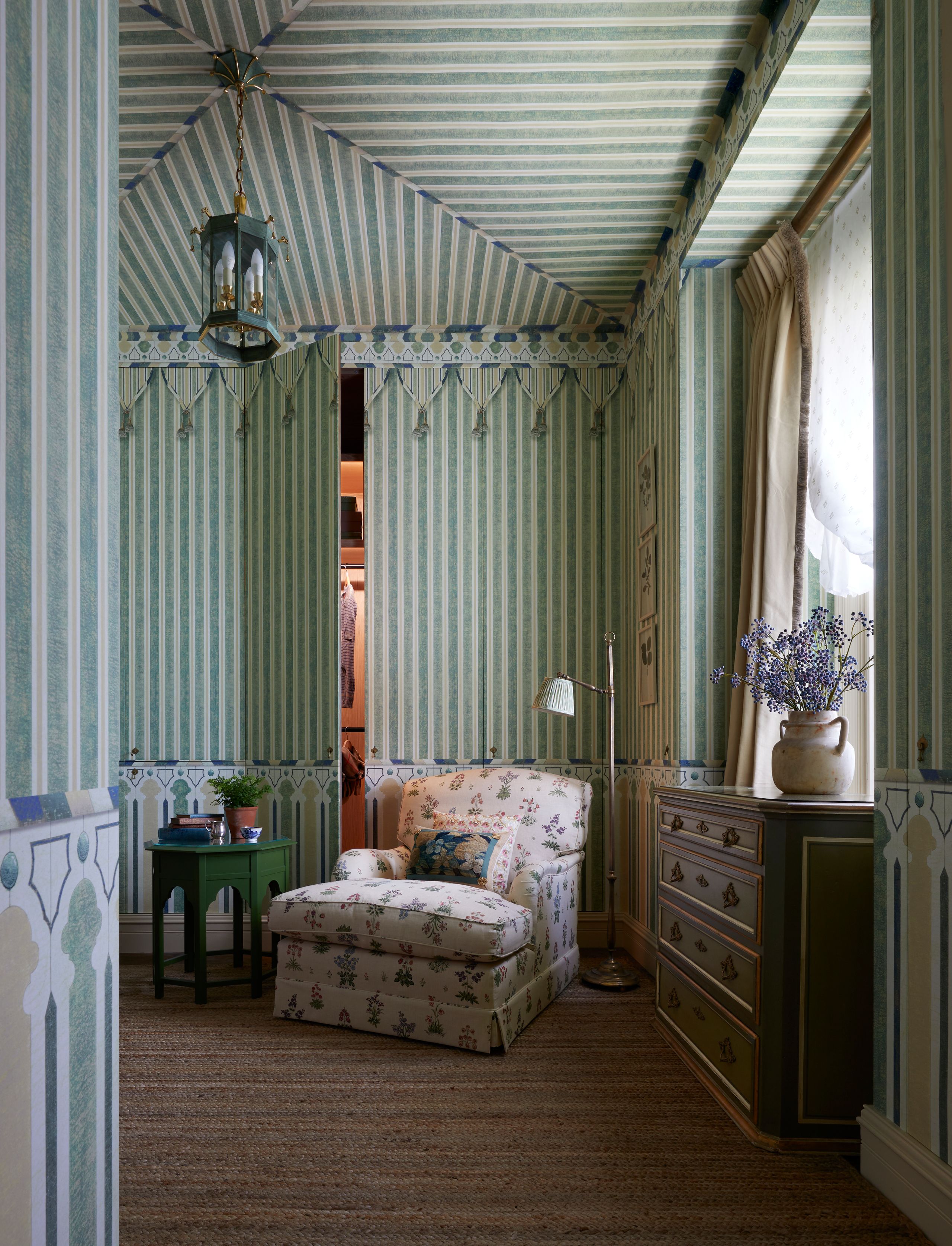 Image may contain: Indoors, Interior Design, Lamp, Plant, Desk, Furniture, Table, Couch, Home Decor, Bed, Bedroom, and Room