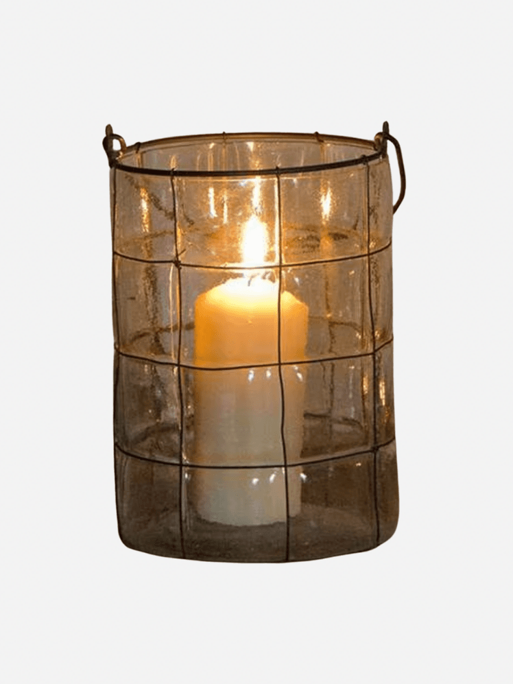 Image may contain: Lamp, Candle, and Lantern