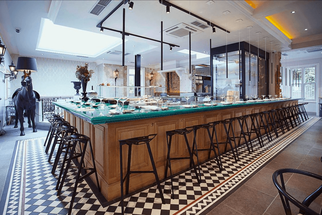 Image may contain Indoors Restaurant Chair Furniture Cafeteria Interior Design Bar Animal Horse and Mammal