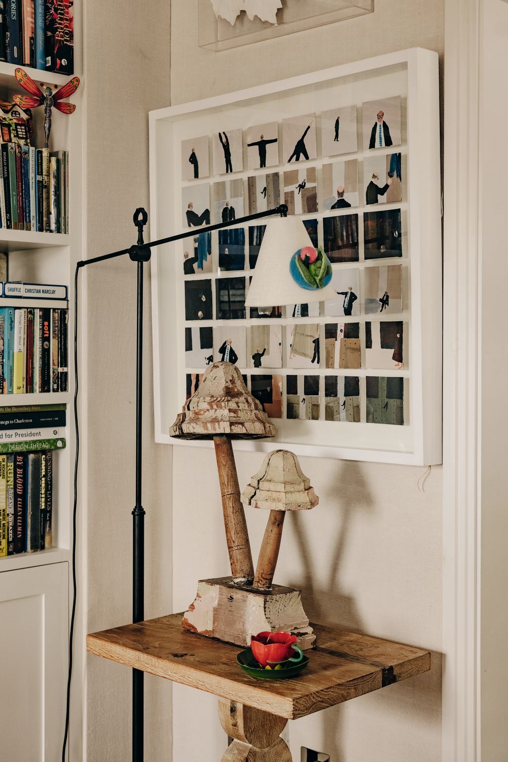 Image may contain Lamp Furniture Person Bookcase Art Painting and Plate