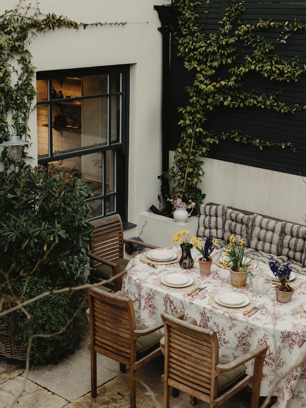 Image may contain Furniture Table Chair Tabletop Dining Table Plate Home Decor Candle Blade Knife and Weapon