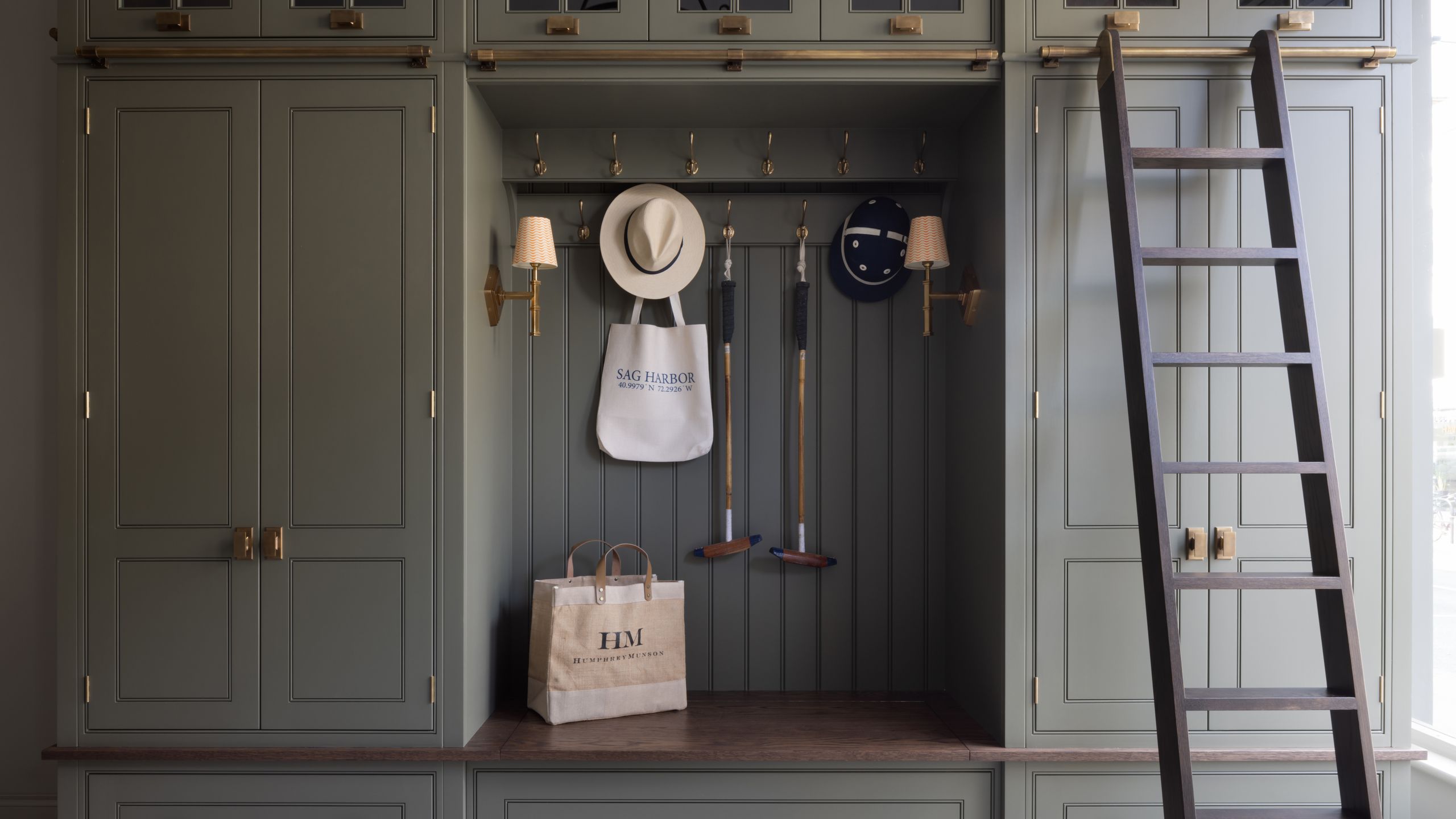 Image may contain: Indoors, Interior Design, Accessories, Bag, Handbag, Lamp, Clothing, and Hat