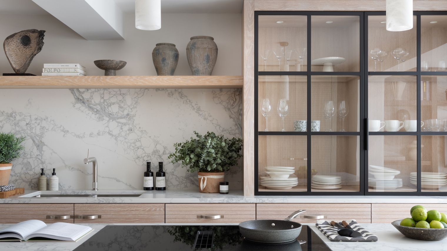 Image may contain: Indoors, Interior Design, Plant, Kitchen, Book, Publication, Cup, Cabinet, Furniture, and Shelf