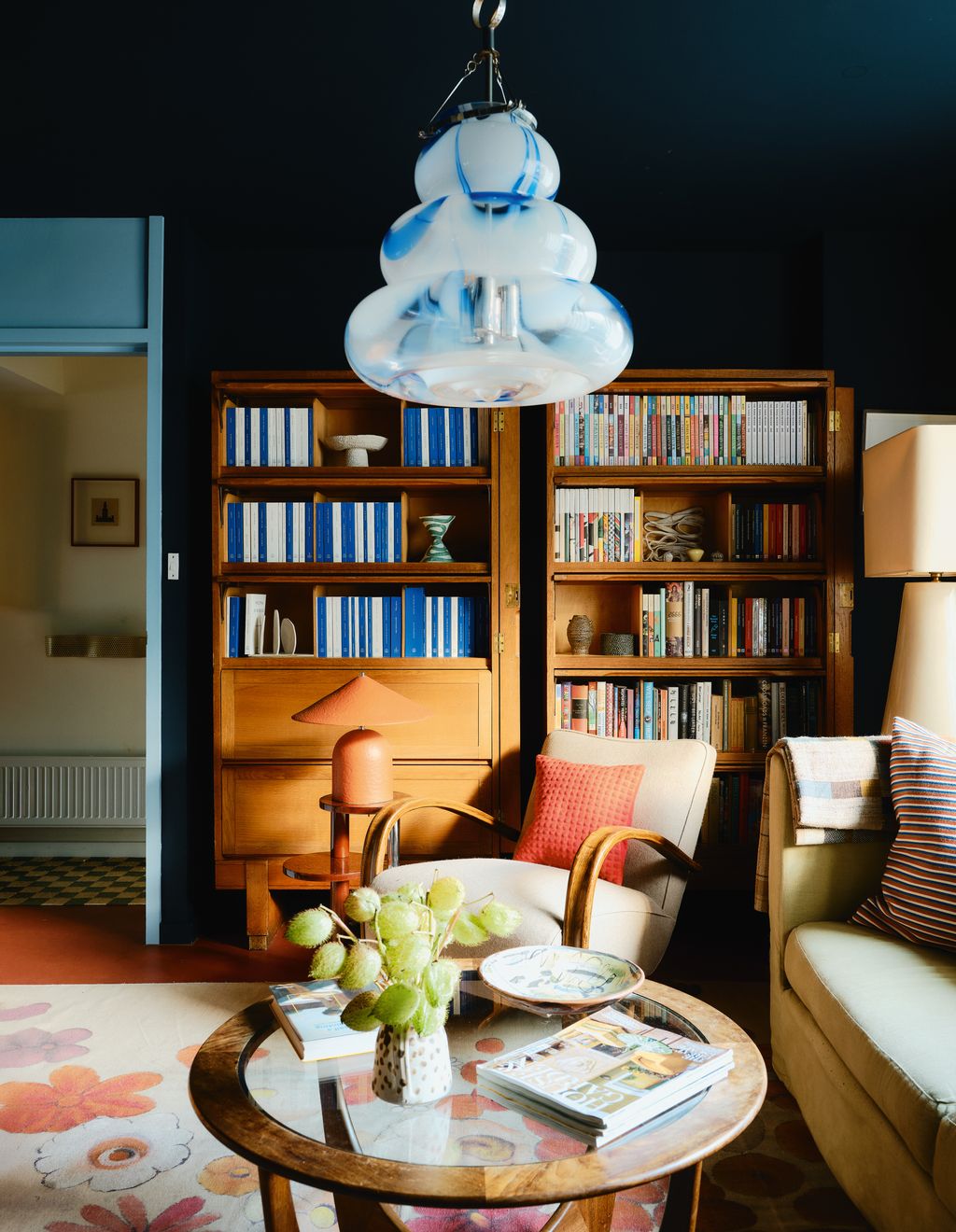 Image may contain Book Publication Architecture Building Furniture Indoors Living Room Room Lamp Couch and Table