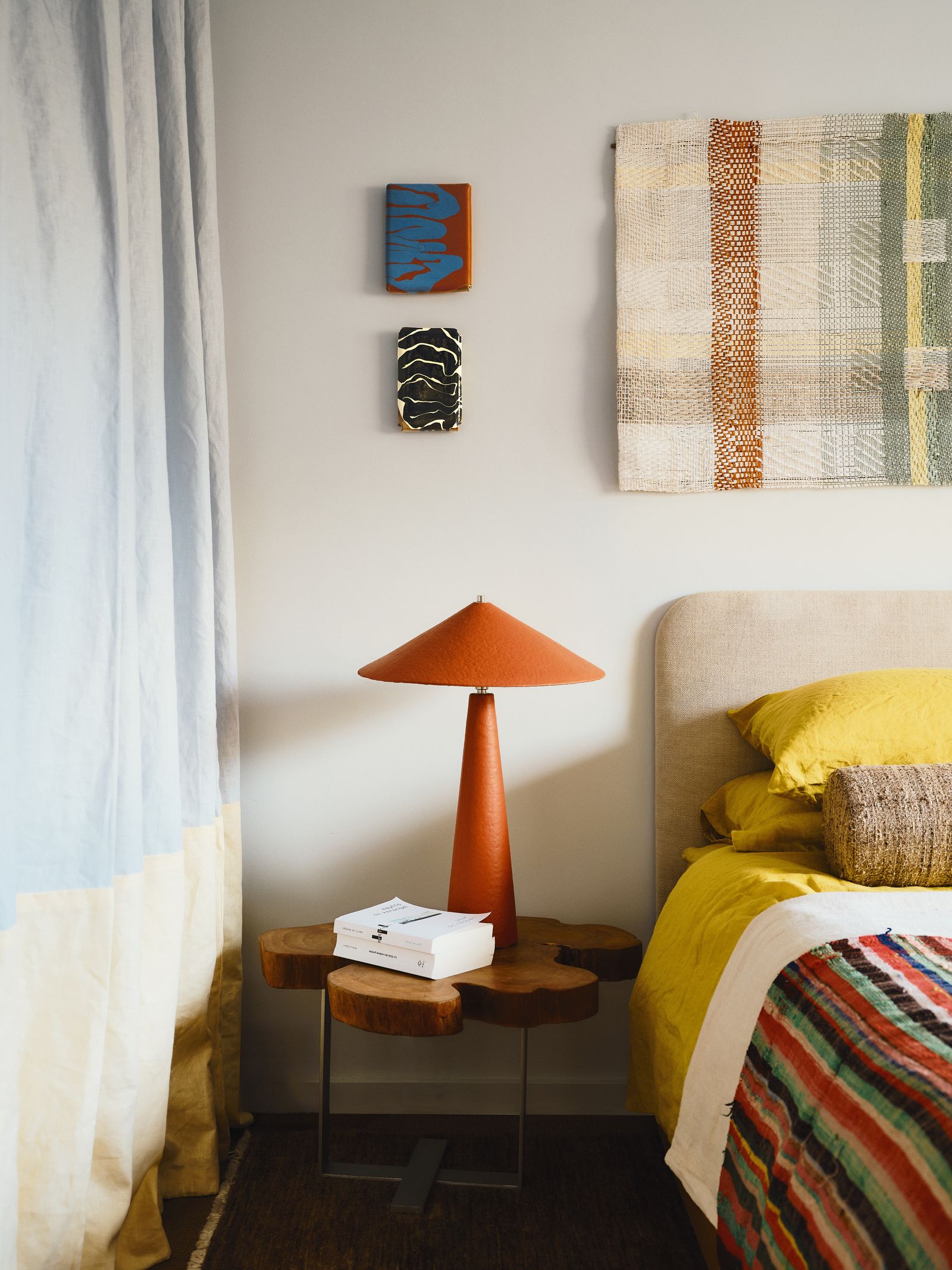 Image may contain Lamp Bed Furniture Cushion Home Decor Bedroom Dorm Room Indoors Room Desk Table and Rug