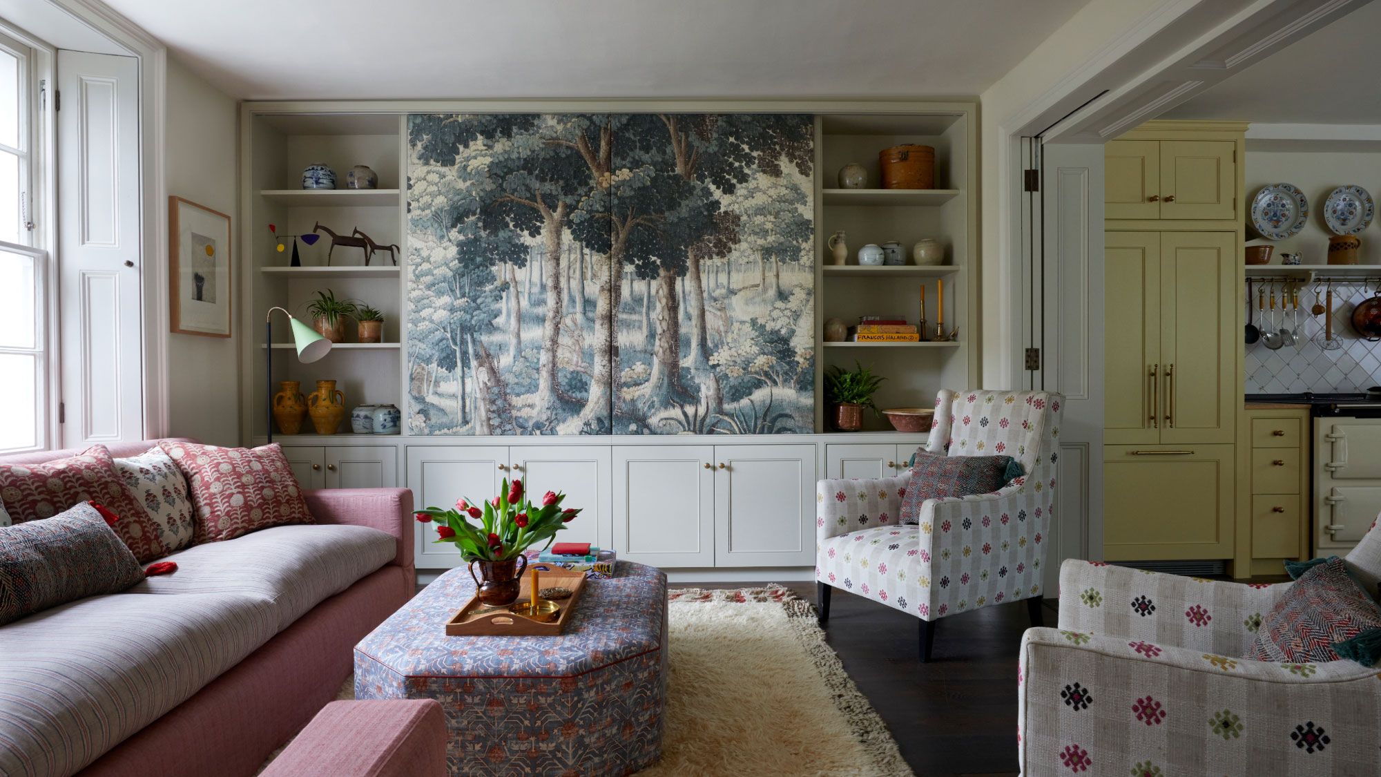 Image may contain: Home Decor, Architecture, Building, Furniture, Indoors, Living Room, Room, Couch, Plant, Chair, and Lamp