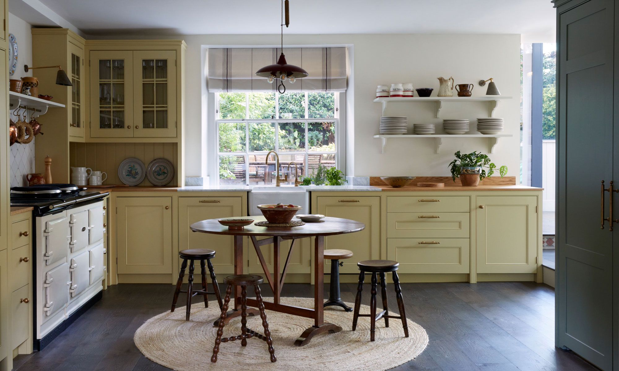 Image may contain: Indoors, Kitchen, Plant, Lamp, Interior Design, Home Decor, Rug, Kitchen Island, and Architecture