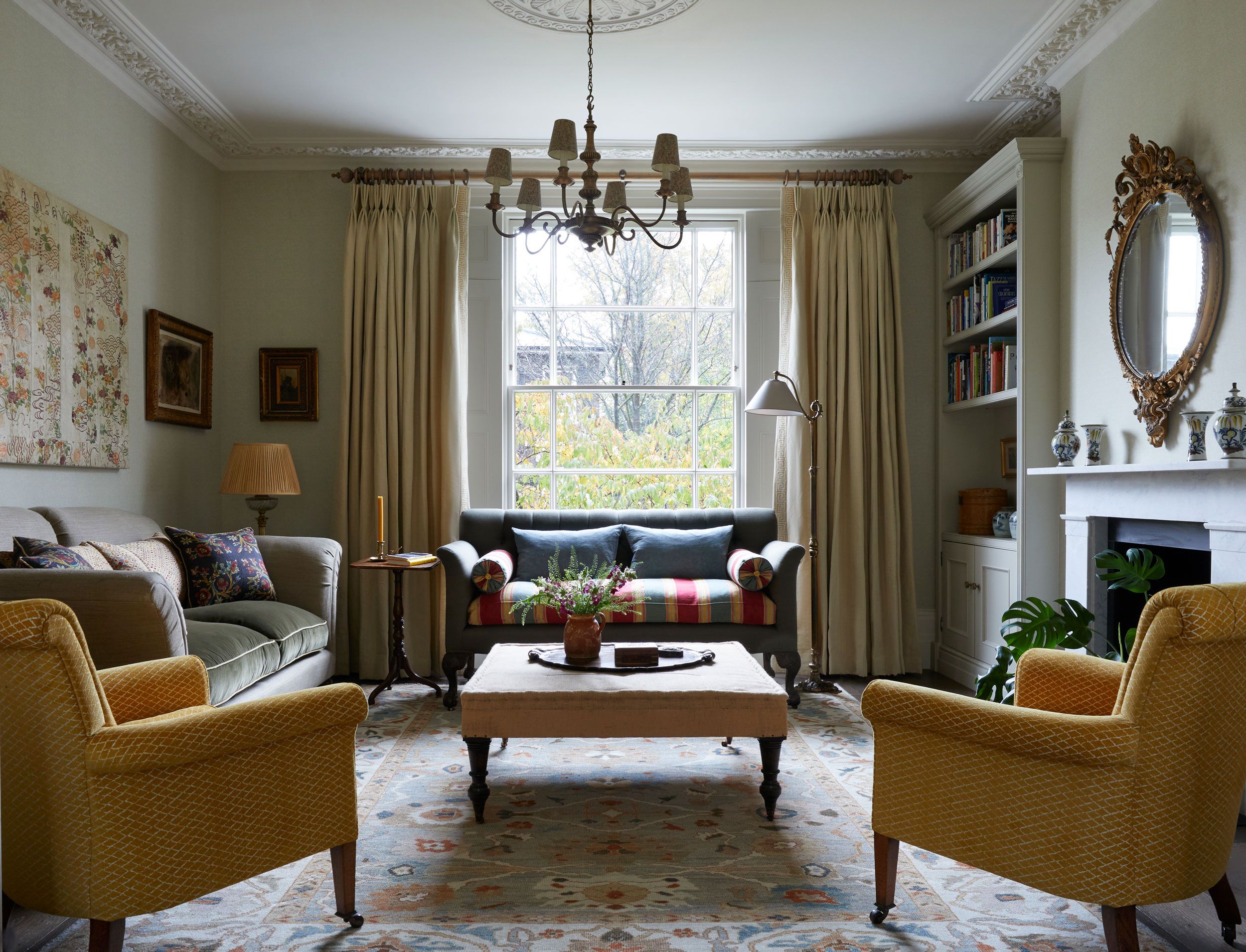 Image may contain: Home Decor, Lamp, Couch, Furniture, Architecture, Building, Indoors, Living Room, Room, Art, and Painting