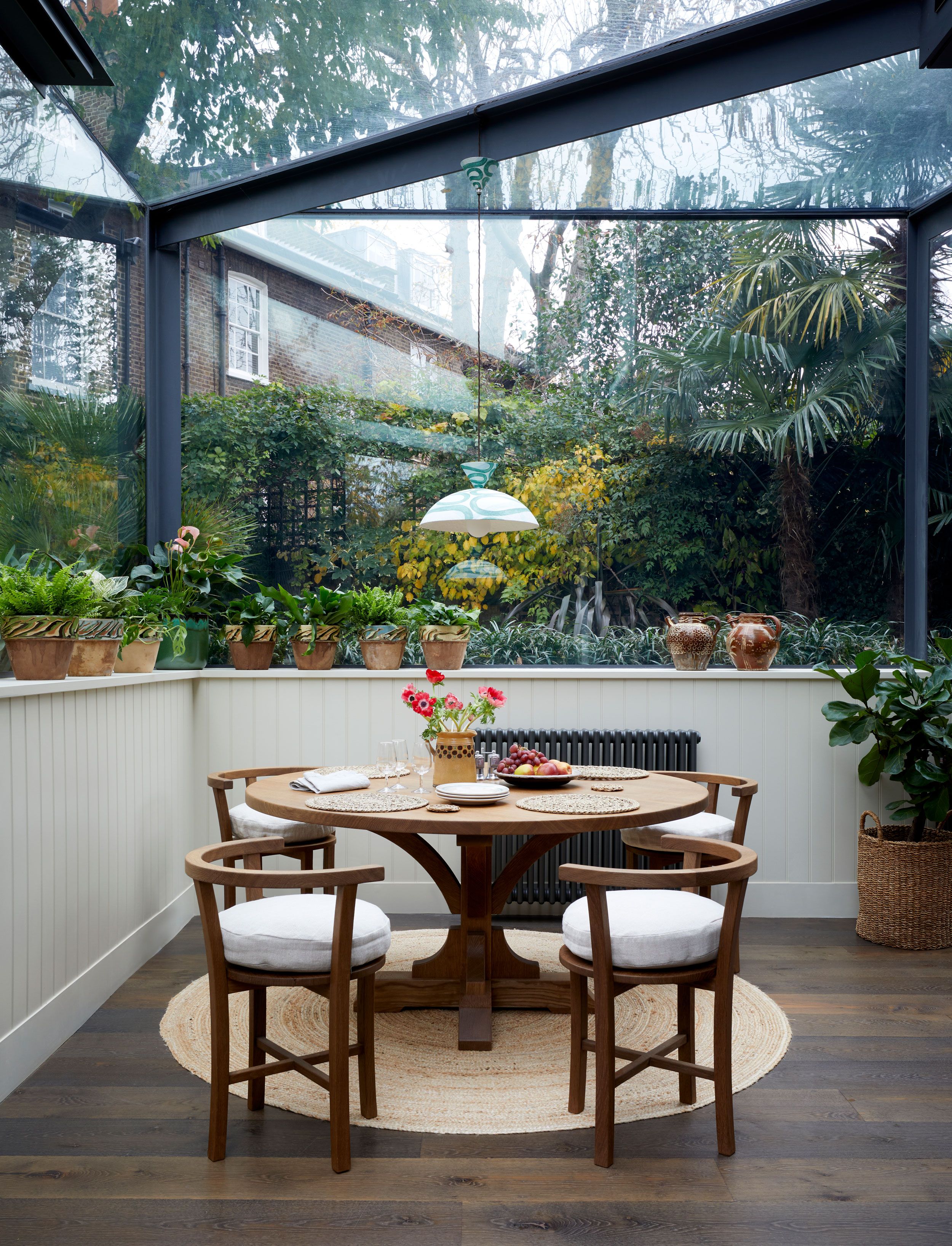 Image may contain: Dining Table, Furniture, Table, Architecture, Building, Dining Room, Indoors, Room, and Plant