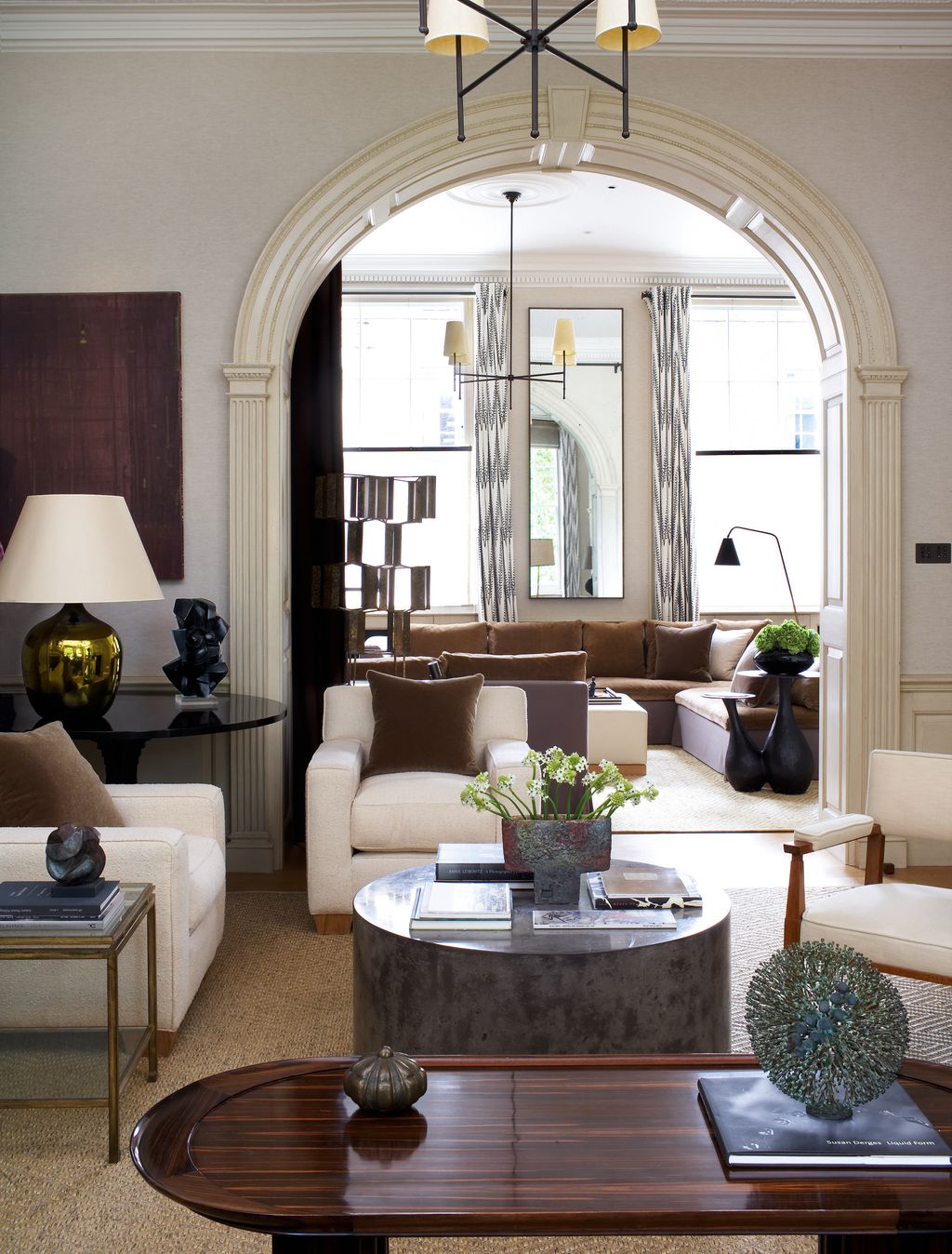 Image may contain Coffee Table Furniture Table Lamp Architecture Building Indoors Living Room Room Couch and Book